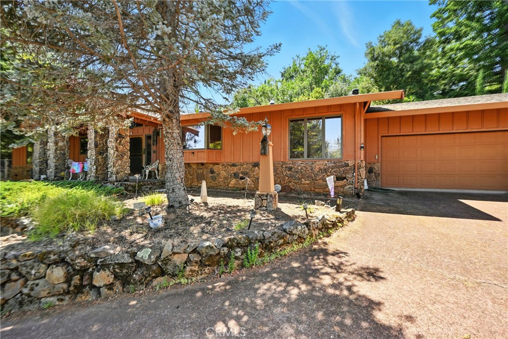 Step into your formal entryway and discover a spacious 2-bedroom, 2-bath residence PLUS an oversized office, could easily be used as a third bedroom. The kitchen is a chef’s dream, boasting custom-built cabinetry throughout, a large island for entertaining, and a thoughtfully designed pantry for effortless organization. Enjoy both a formal living room and a warm, inviting family room complete with a fireplace. The bathrooms feature tile countertops, with one offering a walk-in jetted tub for ultimate comfort. Multiple closets provide ample storage for all your needs. The attached 2-car garage includes a convenient bonus half bath. Outside, take in stunning lake views from the front of the property, while the backyard offers a back deck and a utility shed ideal for landscaping tools or firewood. Both side yards are fully fenced, adding privacy and functionality.