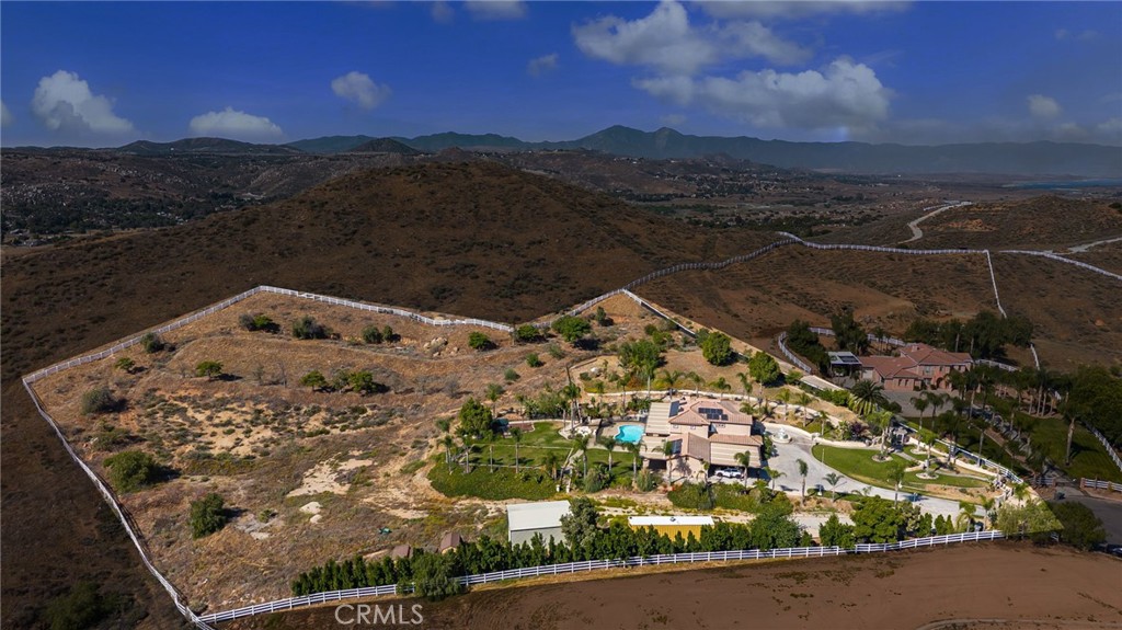 SPECTACULAR 4 ACRE Equestrian Mini-Estate POOL HOME in the Highly Desirable Mockingbird Canyon Community with Endless VIEWS of the Valley, City Lights & Surrounding Hills!! ATTENTION ALL OWNER-OPERATORS, DESERT ENTHUSIASTS and HORSE LOVERS...Plenty of Room for your Trucks, RVs, Boats, Trailers, Horses and More * * OVER $200K in Improvements * * Situated at the END of the CULDESAC and NO MELLO ROOS, NO HOA Fees & LOW LOW Taxes * * EXPANSIVE Floor-Plan offering 3919sqft w/4 LARGE Bedrooms, Bonus Room, Separate OFFICE and 4 Bathrooms * * This Model has a MAIN FLOOR Bedroom with it's OWN Private Bathroom * * Beautifully REMODELED Chefs Quality Kitchen with GRANITE SLAB Counters & Back-Splash, French Antique White Cabinetry, STAINLESS STEEL Appliances, Breakfast Counter for the Kids & Walk-In Pantry * * Formal Living Room & Formal Dining Rooms with SOARING 25ft High Volume Cathedral Ceilings * * UPGRADED Throughout w/REMODELED Bathrooms & Kitchen, Travertine Flooring & Baseboards, DESIGNER Fixtures, Wrought Iron Staircase, Crown Molding, Custom Interior Paint, Recessed Lighting, Custom Front Entry Door, Raised Panel Doors, GATED ENTRY, Fountain, Solar Panels and MUCH MUCH MORE * * Backyard is PERFECT TO ENTERTAIN with Sparkling Saltwater In-Ground Pool (with Safety Fence), FULL-LENGTH Aluma-Wood Covered Patio w/Ceiling Fans, Fenced Yard with Lots of GRASS for the Kids to Play, Fire-Pit, Mature Palm Trees & OVER 35 Fruit Trees and PLENTY of ROOM for your Horses & Animals....This could be the PERFECT Lot for the Owner/Operator with an OVER-SIZED 3 Car Garage w/Outdoor Covered Parking, Multiple Tuff Sheds, Steel RV/Boat Covered Parking, 40ft Container and GATED Access with Room for your RV, Boat, Trailers, Trucks & More * * SPACIOUS Master Bedroom Suite w/Romantic Dual Sided Fireplace, Large Walk-In Closet & Separate Retreat - AND - Master Bathroom w/His & Her Sinks, Oval Garden Tub & Custom Tiled Walk-In Shower * * Great Floor-Plan with Large Bedrooms offers Everyone PLENTY of SPACE * * Situated on a PREMIUM 4 ACRE Lot with your own PRIVATE Gated Entry at the End of a Culdesac * * Close to Schools, Shopping, Restaurants/Dining & EZ Freeway Access * * LOW TAXES and NO HOA * * Terrific Home that will CHECK all of Your Boxes!!