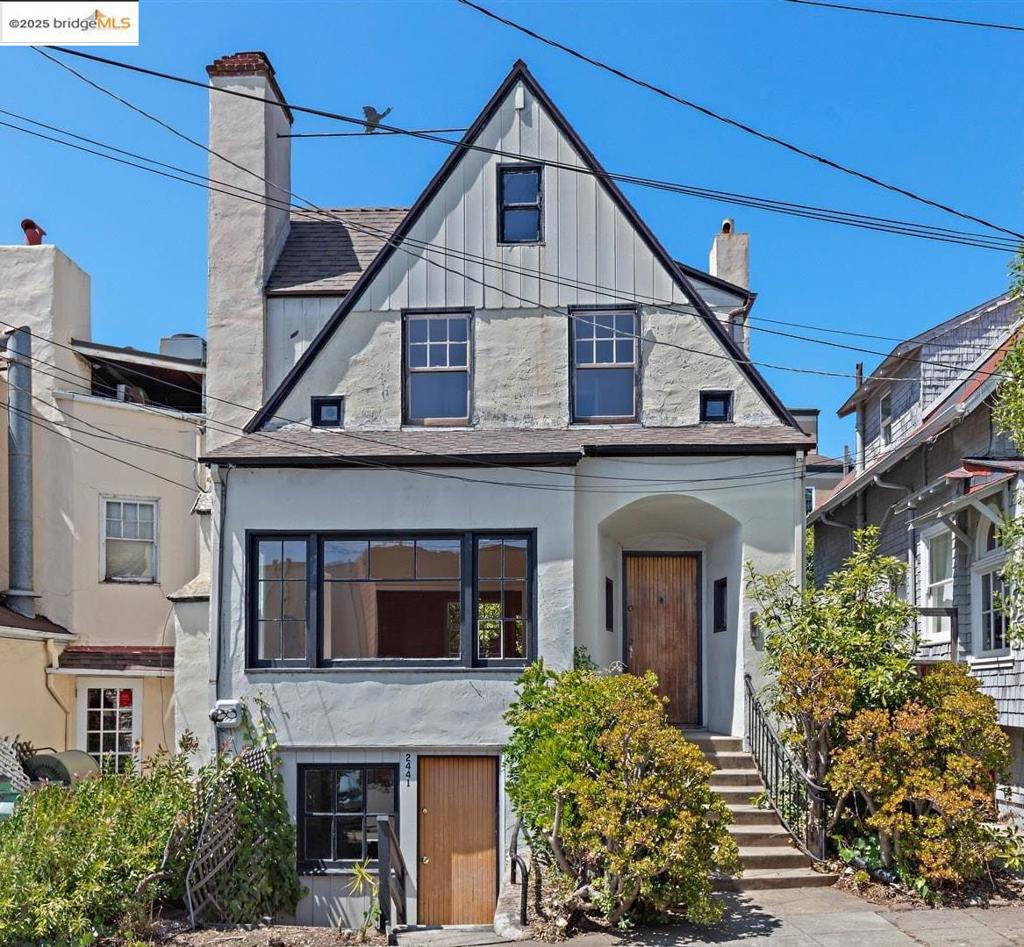 Opportunity near UC Berkeley! In a sweet spot just six short blocks from campus, this three bedroom Tudor-style home awaits a refresh. Character abounds with an arched entryway, decorative nooks, and wrought iron railings. Many original details remain intact, such as hardwood floors, leaded glass accent windows, and vintage hardware. A gracious living room has a stone-tiled fireplace and a wide south-facing picture window. The formal dining room opens to the kitchen, and both overlook a large backyard. The second-floor bedrooms are filled with light from multiple windows, and one room has a balcony overlooking the garden. The attic provides flexible bonus space (693 sq ft) and has a sink vanity.* Additional bonus space (699 sq ft) is located at the bottom level with an extra split bathroom and a separate entry.* Whether you are looking to restore a classic Berkeley home to live in, or looking for strong income potential** (previously rented at $8,200/mo.), 2441 Carleton Street is in an ideal central location adjacent to Telegraph Avenue shops and dining, and so close to campus amenities. Open Sat & Sun, 2-4pm.