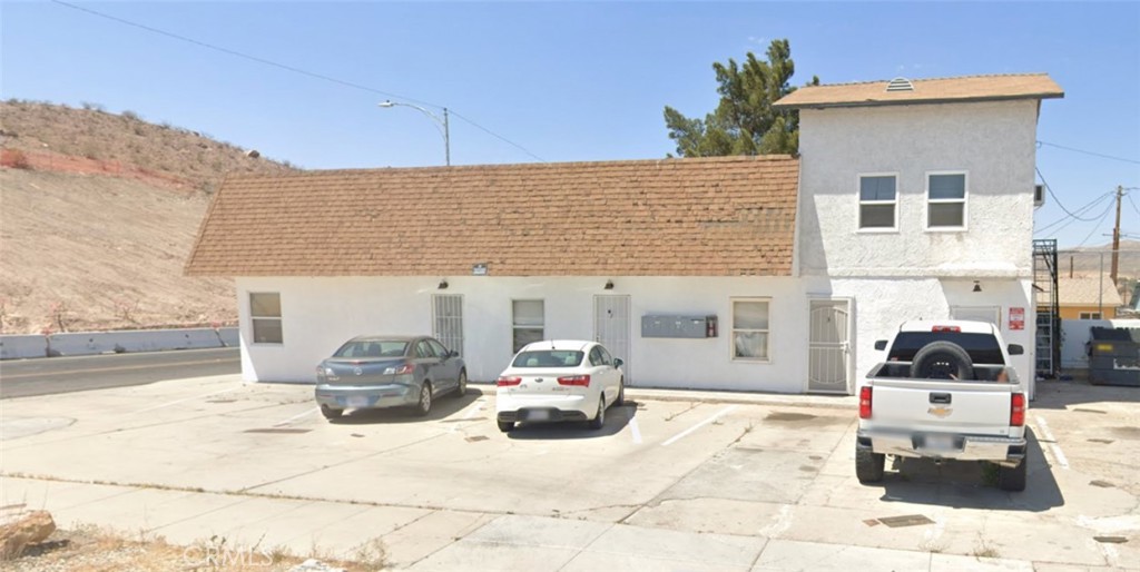 Now available in the heart of Barstow, this charming 2-bedroom, 2-bathroom unit offers 715 square feet of functional living space in a well-maintained, multi-unit community. The interior features durable tile flooring throughout, a spacious living area filled with natural light, and a kitchen with ample cabinetry, granite counters, and a large window above the sink. The bedrooms offer generous proportions, a ceiling fan, and the unit has two spacious bathrooms. Enjoy the comfort of a wall A/C unit and the convenience of assigned parking just outside your door.