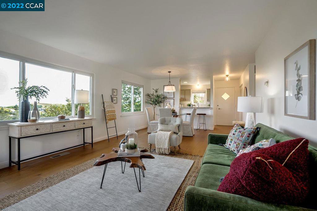 Sweet ONE STORY, LEVEL-IN, END UNIT Gorgeous condo with incredible views of the Rheem Valley and Hills of Moraga 2BR/2BA, open floor plan 1130 Sq.ft. with great light and Master Suite. Indoor/Outdoor living with sliders from the Living Room and Master BR to the large private deck with lovely views. New Hardware floors and new gas range. W/D in unit. Large separate storage unit to keep your living space uncluttered. Close to the beautiful Mulholland Ridge hiking trail and Excellent Moraga Schools.