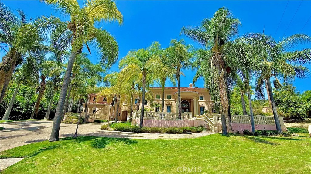 Privately gated and set on nearly 1.25 acres in the tranquil hills near the prestigious Hacienda Golf Club, this extraordinary estate is a true entertainer’s dream, offering a seamless blend of luxury, comfort, and resort-style living. The residence features 7 spacious bedrooms and 7.5 opulent bathrooms, with Italian marble flooring throughout, and a gourmet kitchen equipped with top-of-the-line stainless steel appliances and expansive granite countertops that flows into both casual and formal dining areas. Ideal for hosting, the grand family room connects to a stylish pub room with a wet bar and wine cellar, while the outdoor oasis includes a saltwater pool and spa, two outdoor kitchens—one with a wood-fired pizza oven—a pool house with sauna and full bath, and a hotel-style covered cabana. With three fireplaces, private guest quarters, and close proximity to regional parks and scenic trails, this one-of-a-kind estate captures the essence of refined California living.