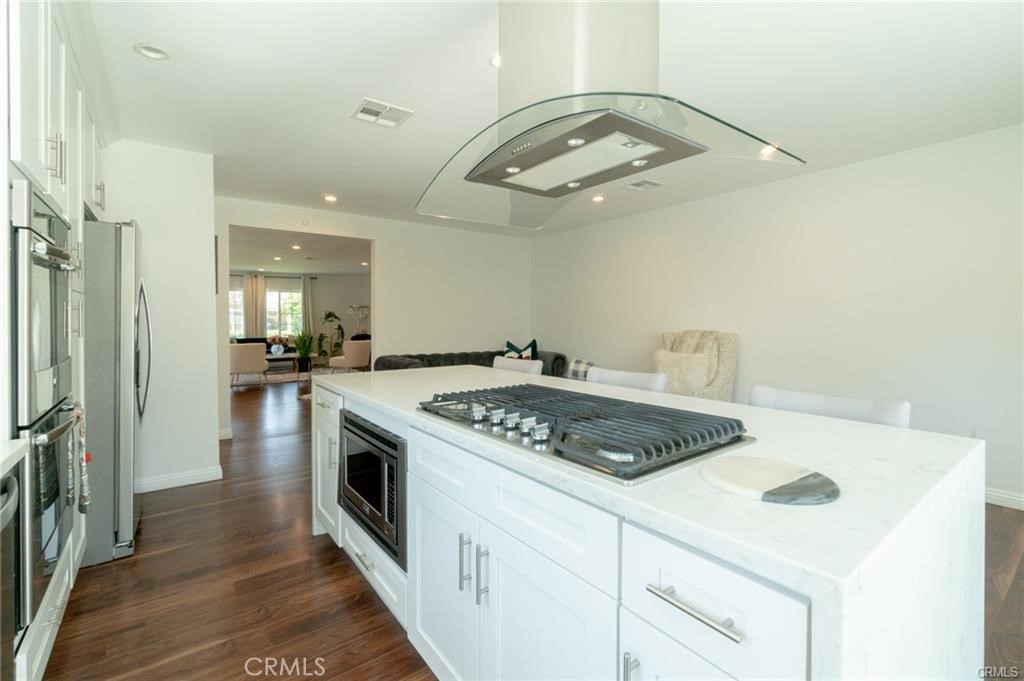 Welcome to this renovated, stunning single story property. Located South of the Boulevard. Upon entering, you are greeted by a spacious open floorplan with recessed lighting throughout, boasts an expansive dining room and living area with fireplace. The master bedroom is brightened by recessed lights, remodeled master bath and walking closet. Each room is enhanced with generous amounts of natural light. Incredible chef's kitchen with center ISLAND, custom cabinets and countertops, top of the line stainless steel appliances. Close to shopping, dining and so much more. A walking distance to Ventura Blvd but far enough from all the noise and traffic. This is a great property, come see it today!