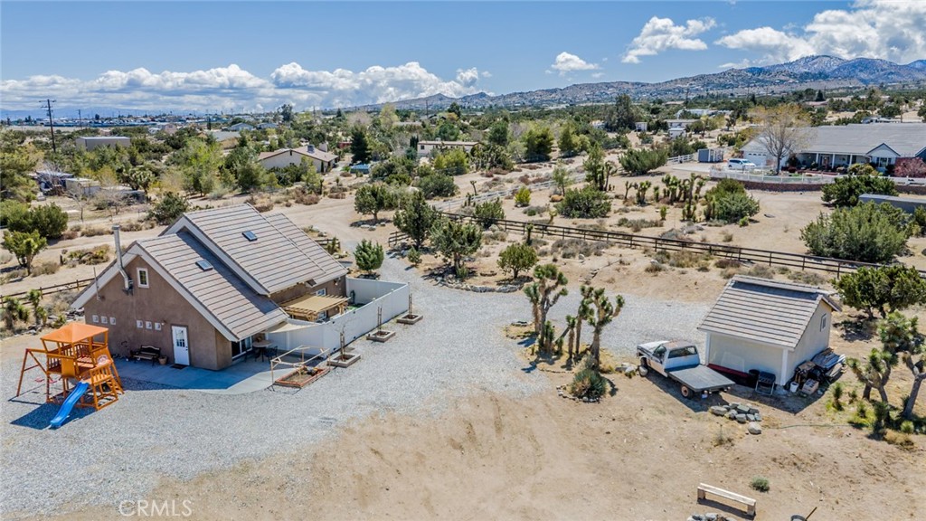 Welcome to Pinon Hills!!! This property has an assumable loan for VA buyers with a 4.5% interest rate. Just under 2 acres, this lot is conveniently close to both Phelan road and Highway 138. This 1,229 sqft home is built with strong CMU block, and large wood timber and has much to offer. With 2 Bedrooms and 1 Bathroom on the main floor and a Kitchen that opens up to the living room - - perfect for entertaining or enjoying family gatherings. Additionally, the first ladder takes you to the loft/office space with a surplus of cubbie storage. The second ladder is on a track that provides access to the middle loft space (the owner has a gym in it) and also the bookshelf above the main bedroom. Seller will leave the following with the house; 300 CMU blocks that were planned to be used for a bedroom addition, along with enough matching roof tile to roof the bedroom addition and then some. They will also leave a new, un-installed, Pella window that matches the existing Pella window installed on the house next to the upper loft area. Essentially, there will be enough materials to nearly build a complete bedroom addition that they planned. This property is also equipped with solar heaters that absorb heat from the sun and pump it via low-energy fans into the house. It works quite well to keep the home warmer year round. The shed is 24'x12' and perfect for storing all your tools. Outside the shed, there are two-220 Volt plugs. Seller currently uses one 220V outlet to charge their electric vehicle and the other one to power a RV. The playset is roughly one year old and is included with the sale. Additionally, a walking path around the property has been created, perfect for exercising or soaking up the natural beauty. Only 10 minutes away from a highly rated charter school, Heritage, and short distance to mountain town Wrightwood and Ski Resort.
Don't miss this opportunity!!