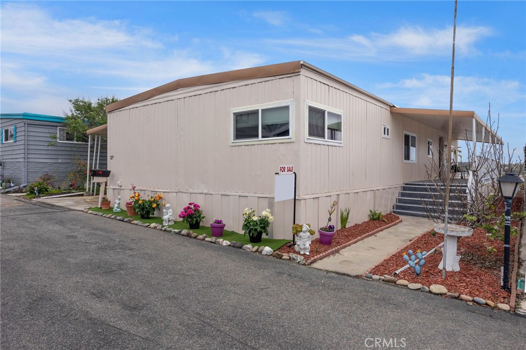Welcome to this tastefully remodeled home tucked away in the private Senior 55+ enclave of Rancho Calevero Mobile Home Park, a rent-controlled community, in the City of Oceanside! Step inside to see the views of the hills and surrounding cities through the large gliding windows. The recently remodeled 2-bedroom, 2-bathroom, large open floor plan features a primary bedroom with an ensuite and walk-in closet, a den/office or 3rd bedroom, a sizeable kitchen, a large living room, dining area, and a spacious separate laundry room. The remodel and upgrades were completed in 2024 and include new elegant off-white kitchen cabinets with soft close drawers and beautiful quartz countertops, newer kitchen appliances, completely remodeled bathrooms with quartz countertops, dual pane energy saving windows throughout, recessed lighting throughout, drywall walls (no paneling), copper wiring, copper water lines, new waterproof vinyl flooring throughout, and wide ADA compliant interior doors. The home was recently leveled and additional piers were added. Enjoy the amenities, including the peaceful quiet of the lake and the beauty and privacy that this community has to offer. Rancho Calevero is a part of the ‘Tri-City’ area of Carlsbad, Vista, and Oceanside and just minutes from shopping, restaurants, hiking trails, and beaches! Come see what's waiting for you!