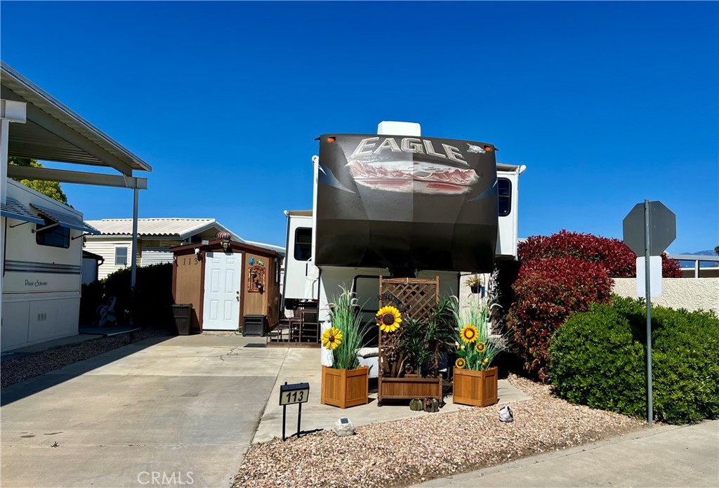 OWN THE LAND! Desired Mt Shadows RV Resort Gated 55+ Senior Community. Beautiful Jayco Eagle Fifth Wheel trailer 2013 included and situated on one of the most convenient and well situated lots in the community. Set up for full time living, recent updates and packed with extras. Fully furnished and move in ready. Mountain Shadows RV Resort is one of the most secure, safe, and well-kept resorts in the Hemet area. The resort is located on the S.W. corner of the City of Hemet, only minutes from the Diamond Valley Lake and recreation center, a short drive to Temecula wine country, mountains and beaches. Close to Urgency medical care, grocery shopping and restaurants. Two club houses to choose from with many amenities including heated saltwater pool, spas, billiards, shuffleboard, picnic areas, gathering areas, large community kitchens, exercise rooms, restroom and showers, laundry rooms, horseshoe pit, ping pong tables, corn hole and more. Full time manager, office and maintenance staff are on duty five days a week year-round. Security staff are on site 7 nights a week, year-round. Low Taxes & HOA Fees of approx $243.65 a month includes water, sewer, trash, cable television & internet as well as covering the owner's assessment for maintenance, operations and capital reserves. The association has an activities committee that plans and organizes an incredible array of events and activities monthly including luncheons, exercise classes, special occasion dinners, matinees, bingo, karaoke and much more. Retire in style!