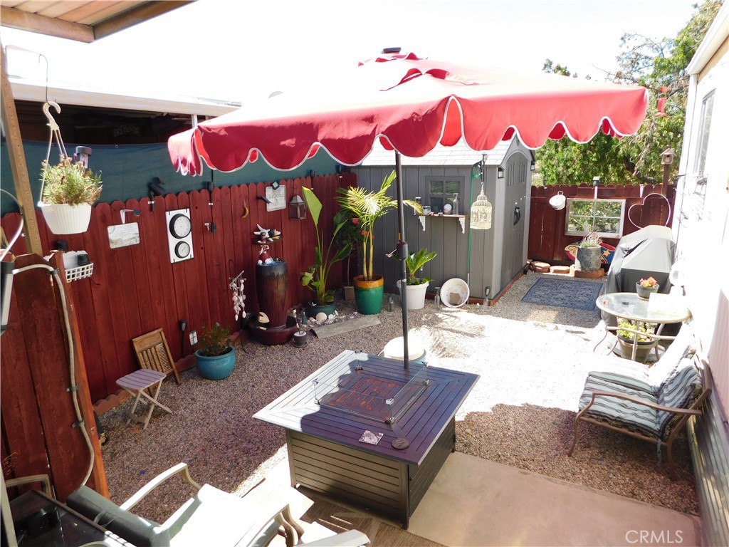 ~~BEAUTIFUL 2 BEDROOM/2 BATH REMODELED TO PERFECTION PLUS A PRIVATE BACKYARD PARADISE~~LOCATED ON THE BACK PERIMETER IN YUCAIPA'S 55+ COMMUNITY OF YUCAIPA VILLAGE, LOW SPACE RENT ONLY $437~~UPGRADES IN 2023 INCLUDE...BACKYARD FENCING & LANDSCAPING, PAINTED KITCHEN CABINETS, QUARTZ COUNTER TOPS, NEW STOVE, GARBAGE DISPOSAL, SINK & FAUCET PLUS REAL HARDWOOD FLOORS, REMODELED HALL BATHROOM WITH BARNWOOD ACCENT WALL, NEW TUB SURROUND, SHOWER FIXTURE, FAUCET, 2 NEW LIGHTS, NEW TOILET PLUS REAL HARDWOOD FLOORS, NEW TOILET IN FRONT BATHROOM, NEW WATER HEATER IN OCT 2024, NEW SMART WINDOW AC WITH APP IN FRONT BEDROOM, NEW BREAKER PANEL BOX, NEW GAS METER, 5 NEW CEILING LIGHTS THROUGHOUT, NEW TUFF SHED IN 2024, NEW BACK STEPS, NEW STACKABLE WASHER & DRYER INCLUDED ONLY 9 MONTHS OLD PLUS A RING CAMERA SYSTEM WITH 4 SEPARATE CAMERAS~~LARGE LIVING ROOM OPENS TO THE BRIGHT EXPANDO AREA PERFECT FOR FORMAL DINING ROOM/OFFICE OR HOBBY AREA~SPACIOUS KITCHEN WITH EAT-IN DINING AREA OR PLENTY OF SPACE FOR A FULL SIZE CHINA HUTCH OR PORTABLE ISLAND...FRIDGE INCLUDED~THE FRONT BEDROOM IS KING SIZE WITH FULL SIZE CLOSET PLUS BUILT-INS~BATHROOM HAS A WALK-IN SHOWER WITH ENCLOSURE~THE BACK BEDROOM IS FULL SIZE~HALL BATH HAS A TUB/SHOWER~H U G E PRIVATE BACK YARD OASIS FULLY FENCED WITH SPECTACULAR VIEWS AND EASY ACCESS TO THE PARK COMMUNITY SITTING AREA~QUAINT FRONT PORCH~2 VEHICLE CARPORT WITH SLIDING WOOD FENCE PLUS A METAL SHED~***CALL FOR A TOUR, YOU WILL DEFINITELY BE IMPRESSED***