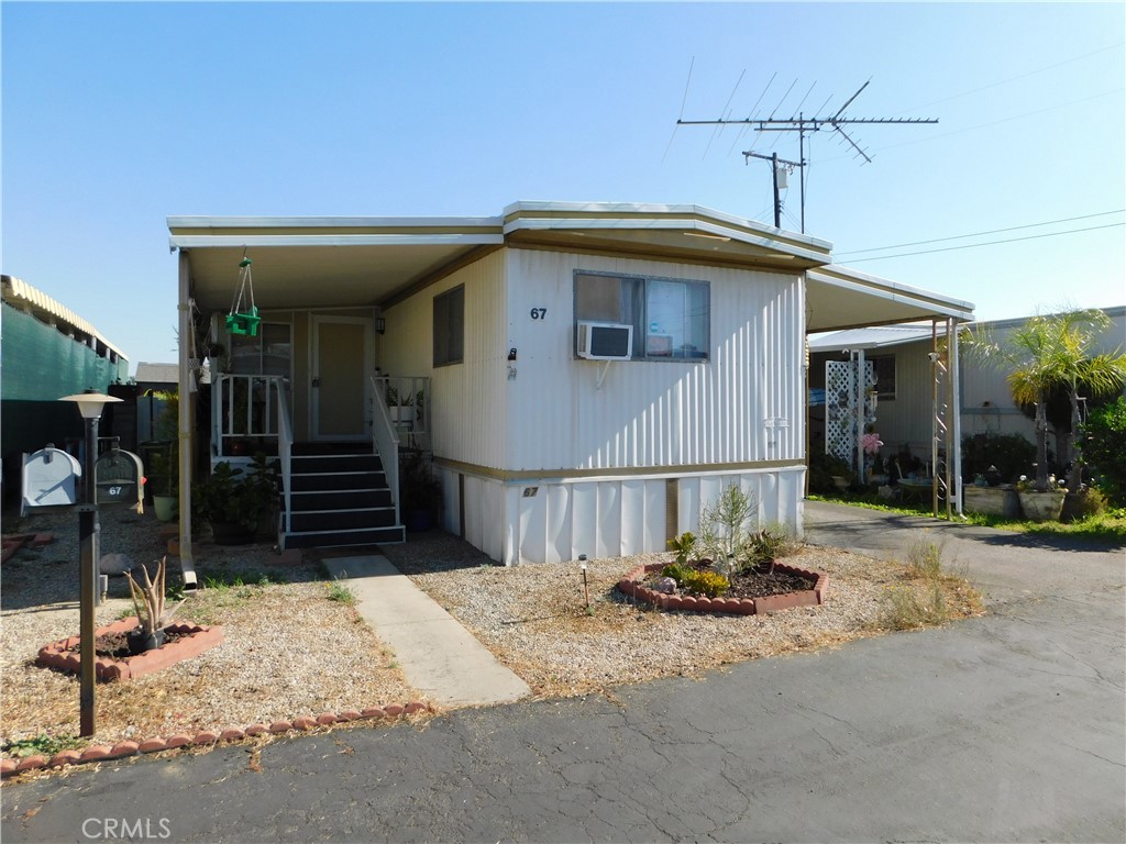 ~~BEAUTIFUL 2 BEDROOM/2 BATH REMODELED TO PERFECTION PLUS A PRIVATE BACKYARD PARADISE~~LOCATED ON THE BACK PERIMETER IN YUCAIPA'S 55+ COMMUNITY OF YUCAIPA VILLAGE, LOW SPACE RENT ONLY $437~~UPGRADES IN 2023 INCLUDE...BACKYARD FENCING & LANDSCAPING, PAINTED KITCHEN CABINETS, QUARTZ COUNTER TOPS, NEW STOVE, GARBAGE DISPOSAL, SINK & FAUCET PLUS REAL HARDWOOD FLOORS, REMODELED HALL BATHROOM WITH BARNWOOD ACCENT WALL, NEW TUB SURROUND, SHOWER FIXTURE, FAUCET, 2 NEW LIGHTS, NEW TOILET PLUS REAL HARDWOOD FLOORS, NEW TOILET IN FRONT BATHROOM, NEW WATER HEATER IN OCT 2024, NEW SMART WINDOW AC WITH APP IN FRONT BEDROOM, NEW BREAKER PANEL BOX, NEW GAS METER, 5 NEW CEILING LIGHTS THROUGHOUT, NEW TUFF SHED IN 2024, NEW BACK STEPS, NEW STACKABLE WASHER & DRYER INCLUDED ONLY 9 MONTHS OLD PLUS A RING CAMERA SYSTEM WITH 4 SEPARATE CAMERAS~~LARGE LIVING ROOM OPENS TO THE BRIGHT EXPANDO AREA PERFECT FOR FORMAL DINING ROOM/OFFICE OR HOBBY AREA~SPACIOUS KITCHEN WITH EAT-IN DINING AREA OR PLENTY OF SPACE FOR A FULL SIZE CHINA HUTCH OR PORTABLE ISLAND...FRIDGE INCLUDED~THE FRONT BEDROOM IS KING SIZE WITH FULL SIZE CLOSET PLUS BUILT-INS~BATHROOM HAS A WALK-IN SHOWER WITH ENCLOSURE~THE BACK BEDROOM IS FULL SIZE~HALL BATH HAS A TUB/SHOWER~H U G E PRIVATE BACK YARD OASIS FULLY FENCED WITH SPECTACULAR VIEWS AND EASY ACCESS TO THE PARK COMMUNITY SITTING AREA~QUAINT FRONT PORCH~2 VEHICLE CARPORT WITH SLIDING WOOD FENCE PLUS A METAL SHED~***CALL FOR A TOUR, YOU WILL DEFINITELY BE IMPRESSED***