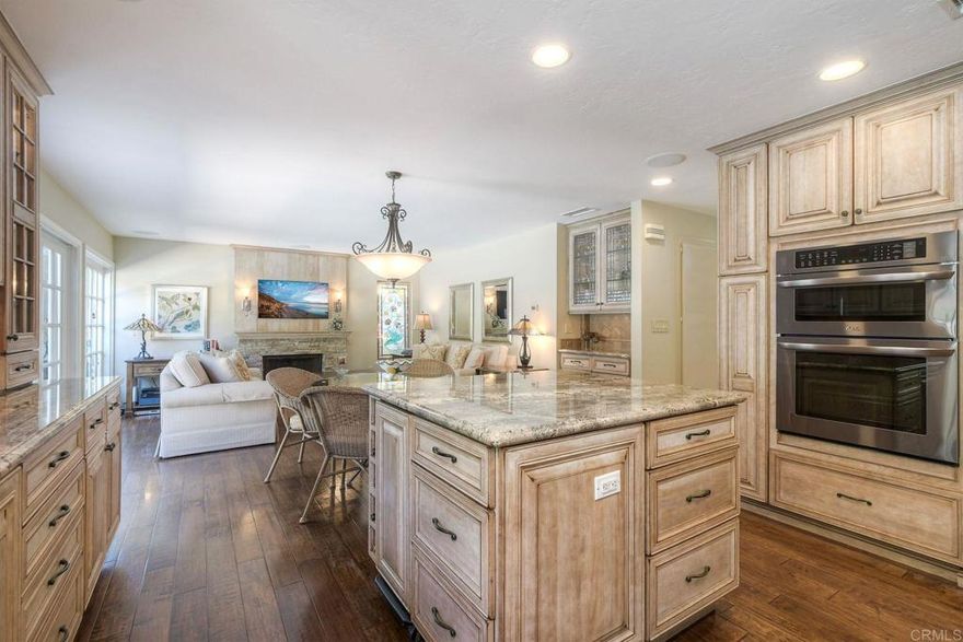 Resort-Style Living in a Quiet, Family-Friendly Neighborhood. Step into luxury with this beautifully upgraded home designed for comfort, functionality, and entertaining. The open-concept kitchen and family room are the heart of the home, featuring a large island, Omega cherry hand-rubbed solid wood cabinetry, Brazilian granite counter tops, and a tumbled Travertine back splash. High-end appliances include a Sub-Zero counter-depth refrigerator, Bosch 5-burner gas cook top, over sized dishwasher, warming drawer, and LG convection oven with microwave. The spacious primary suite offers a relaxing retreat with custom closets and ceiling fan. A gorgeous re-imagined primary bath features a large glass-enclosed shower, separate Jacuzzi soaking tub, and Italian tile finishes with dual sinks. Step outside to your backyard paradise, complete with a lighted solar-heated pool, newly resurfaced patio, lush landscaping, artificial turf, and a charming flagstone garden patio. Multiple dining and lounging areas—including a “secret garden” ideal for alfresco dining or morning coffee—make this the perfect setting for entertaining. Enjoy outdoor living with built-in speakers, extensive auto-controlled lighting, and plenty of space to gather. The garage has been fully upgraded with a newly epoxied floor, custom cabinetry with ample storage, and a large rolling workbench. Additional features include: Owned solar system (27 panels, 9-kilowatt.) with net metering—no electric bill. Central air conditioning. Arlo security system. Low HOA fees. A family-friendly community with three nearby parks. Highly ranked school district and convenient shopping close by. This exceptional property blends everyday comfort with thoughtful luxury, offering the perfect setting to create lasting memories. See the 4 page highlights in the documents tab!!