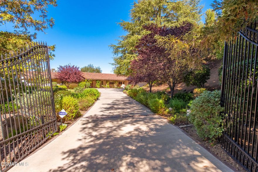 A Rare Opportunity to Create your Dream Estate in one of Thousand Oaks most coveted hidden enclaves! Tucked behind the private gates of Los Robles Hills Estates, this single-story residence (no steps inside) sits on over an acre of land, surrounded by mature trees, sweeping Conejo Valley views, and the kind of quiet luxury that is increasingly hard to find. With only 28 custom homes, this exclusive community offers unmatched privacy, natural beauty, and a lifestyle defined by space and serenity. Step inside and experience the scale of a home designed for both grand entertaining and effortless daily living. 4,544 square feet of open, flowing interiors include soaring vaulted ceilings, expansive gathering spaces, and an impressive great room anchored by a classic wet bar. This expansive room effortlessly adapts to your vision, whether it's a plush, wraparound sectional for game day gatherings, a sophisticated billiards setup, or multiple intimate lounge areas for relaxed entertaining. Sunlight pours through a wall of windows, creating a warm, inviting glow and a seamless harmony between indoor living and the tranquil beauty of the outdoors. A spacious entertainer's kitchen anchors the home, connecting to light filled living and dining rooms with beautiful vaulted ceilings and timeless architectural character. Every corner of the residence invites you to envision your own elevated style, whether modern or classic luxury. The floorplan features 4 bedrooms and 3.5 baths, including a private wing with two generous secondary bedrooms and a serene primary suite offering a walk-in closet, sliding glass doors, a vanity area, sunken tub, and separate shower. A large indoor laundry room and flexible bonus room with a cedar-lined walk-in closet provide additional options for an office, staff quarters, fitness room, or creative space. Outside, the possibilities are endless. The expansive view lot offers room to reimagine the grounds with resort worthy outdoor living, pool, gardens, entertaining patios, or anything else your lifestyle inspires.A three-car garage, two-car covered carport, and long private driveway ensure ample parking for residents and guests. The property also features a detached  multi-purpose studio shed, an ideal space for hands-on projects, creative pursuits, or simply organizing the essentials of daily living. It's a flexible extension of the home that adapts effortlessly to your needs. And while the estate feels worlds away, you're just minutes from Westlake Village, top rated amenities, and beloved hiking and biking trails.This is more than a home, it's a canvas for your vision. A rare opportunity that doesn't come around very often in one of the Conejo Valley's most prestigious neighborhoods.  Photos have been virtually staged