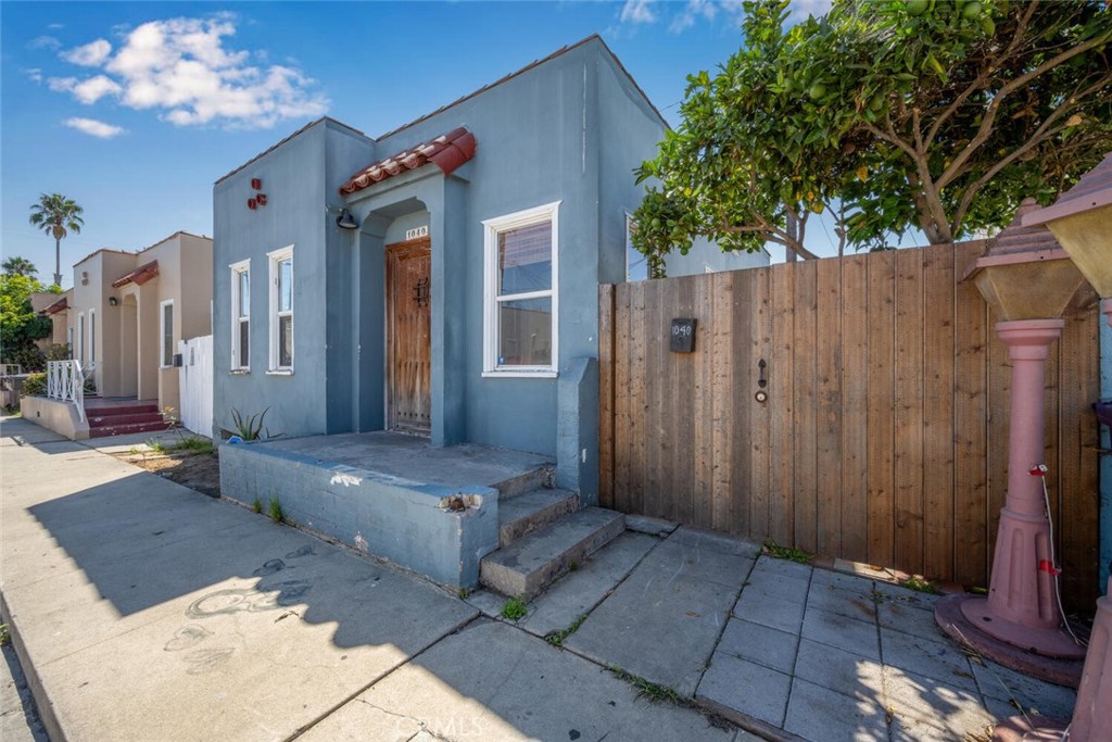 Charming Spanish style Single Family Home on a private street in this coastal city! This 2 bed and 1 bath home with NO HOA includes a great floor plan with Living room, Kitchen and interior laundry. Enjoy your private outdoor space and the home also comes with a private parking space just outside the front door. No where in Long Beach can you find a better value for a single family detached home. Prime location just 10 minutes to the beach, Pike Outlets, the Aquarium, Shops, Restaurants and all the best that Long Beach has to offer. Don’t Miss Out!!!