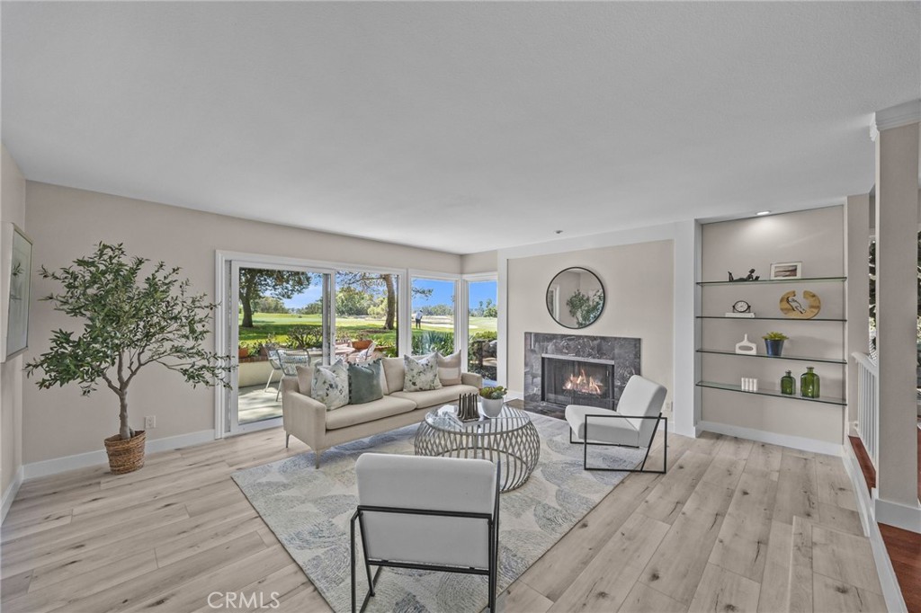 Welcome to this beautifully upgraded 3-bedroom, 2-bathroom single-level condo perfectly situated along the fairways of Rancho San Joaquin Golf Course. This rare ground-floor home offers panoramic golf course views from nearly every room, creating a serene and picturesque backdrop for everyday living. Step inside to find spacious, light-filled living areas with new flooring, recessed lighting, and upgraded windows and doors throughout. The remodeled kitchen features modern finishes, ample cabinet space, and comes complete with all appliances—including the refrigerator, wine fridge, stove, microwave, and dishwasher. The inviting living room is the perfect gathering spot, highlighted by a cozy fireplace and direct access to one of the home’s three private patios overlooking the lush greens. The oversized primary suite offers breathtaking golf course views and a peaceful retreat, while the second bedroom is generously sized with a ceiling fan for added comfort. The third bedroom has been thoughtfully designed as a home office or flex space, complete with built-in desks and cabinetry — ideal for working from home or creative projects. This room can easily be converted back to a bedroom if desired. Additional features include a separate laundry room with a new side-by-side washer and dryer, a detached two-car garage, and access to the community pool. Located in the heart of Irvine, you’ll enjoy easy access to bike trails, hiking, shopping, dining, entertainment, the airport, and top-rated schools. Don’t miss this opportunity to own one of the most desirable homes in Rancho San Joaquin Villas — where comfort, convenience, and unbeatable views come together. (Please note: there is a walkway with a flight of stairs leading down to the front door.)