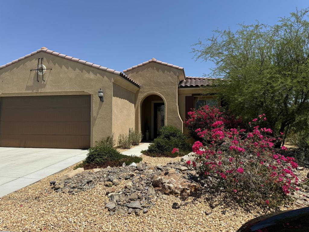 Welcome to Del Webb at Rancho Mirage & embrace upscale 55+ active adult living. An elevated aesthetic will be yours in this popular SANCTUARY model home. Property comes furnished and can be leased yearly or seasonaly Yearly price is $4000 per month. Prime corner in desirable early phase one location on quiet cul-de-sac near pathway to clubhouse. Oversized 9,000+ sq ft lot! Vibrant desert landscaping creates welcome curb appeal. Northern exposure with mountain views from every corner. Enter custom glass paneled front door to soaring 10' ceilings. Oversized windows & slider let in plenty of natural light. Home designed for entertaining. Great room enhanced by wall-to-wall built-in wet bar with expanded cabinetry. Gourmet kitchen boasts center floating island, quartz counters & backsplash, walk-in pantry. Primary suite with spa-like bath & walk-in closet. Sliding glass door beckons to inviting outdoor space. Backyard features spacious covered patio enhanced by flagstone look hardscape & pavers, lush-feeling faux turf & circular raised planter (doubles as extra seating). PLUS custom BBQ island & your own private hot tub. Solar package includes 18-panels, combined with Tesla power wall for additional energy cost savings. Garage with 4-ft builder upgrade extension; built-in storage cabinets, overhead shelving & mini-split AC system. Guard-gated community offers world-class amenities to enjoy--clubhouse, resort-style pools, spa, fitness center, pickleball, tennis & more. Truly move-in ready. Stop searching & START living!