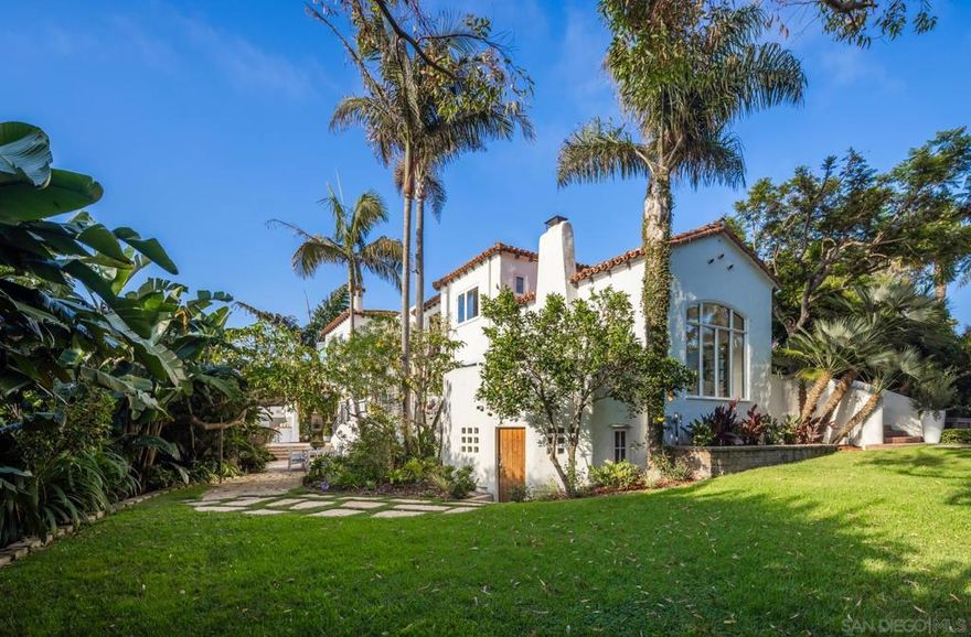 Welcome home. Situated on a fully fenced, spacious corner "double lot" with breathtaking panoramic ocean views, this incredible Spanish Colonial Revival oozes character, charm, warmth & beauty from every corner. Historically designated & part of the Mills Act (yielding tax benefits) , this architectural masterpiece has been restored & updated making it modern, timeless & elegant. Original tile work, lighting & hardwood floors throughout. The luscious landscape surrounds the saltwater pool, open yard space & jacuzzi. Patios are scattered throughout, each with their own views & orientation. Updates include: 90+ double pane window units replaced, roof repairs, new HVAC units, new ducting, upgrades to exterior grounds, landscape cleanup, drainage additions, new kitchen appliances, new pool pump & pool cover, refurbished fireplaces, whole house water filtration system & softener installed, custom window treatments with black out lining, new security system with cameras, sensors & keypad locks, & more. 4 bedrooms upstairs with 1 down + an office & plenty of space for an ADU addition. Do not miss this once-in-a-lifetime opportunity.