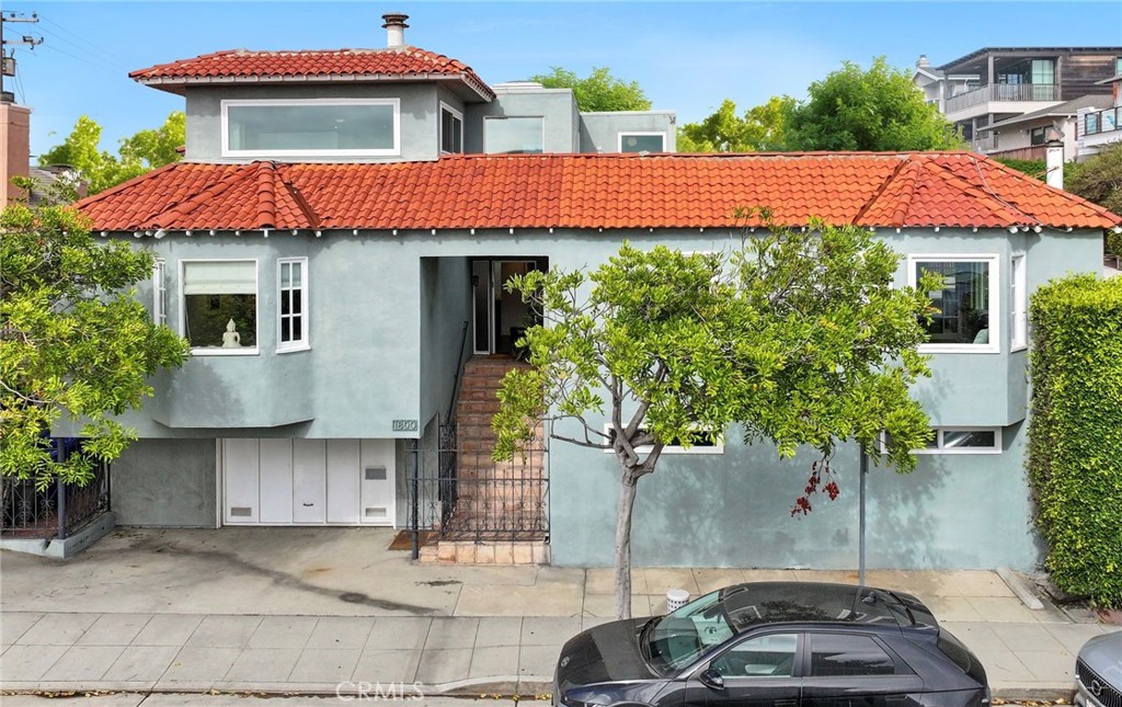 **Inviting Ocean View Home in Manhattan Beach’s Prestigious Sand Section**
This multi-level, corner lot home features ocean views and has been thoughtfully reimagined into a versatile coastal haven over the years. This property features a two-bedroom, three-bathroom main house and a separate, sizable one-bedroom, one-bath apartment with its own entrance. The spacious side deck with sweeping ocean views is ideal for entertaining or soothing sunset vistas.
For convenience, an elevator will take you from the large garage to the main floor. The living room has hardwood floors, a gas fireplace, an open built-in bar leading to the powder room, and a glass-enclosed exercise room. Step up to the office that leads to a beautifully designed kitchen and dining area with a wood-burning fireplace and ocean views. The adjacent bright, airy bedroom features an en-suite bathroom.
The top floor commands a spacious primary suite with panoramic ocean views from the bedroom and bathroom. A skylight brightens the large built-in tub and shower. The suite has a gas fireplace, ample storage, an open walk-in closet, and a large dressing area with double sinks.
Offered fully furnished, this home is ready for you to embrace the ultimate beach lifestyle. Discover your dream home in the heart of Manhattan Beach, consistently ranked as one of the best places to live. The location of this remarkable residence offers an active lifestyle with year-round surfing, volleyball, biking, and it’s just steps from the beach and blocks to world-class dining. Located approximately 5 miles from LAX, this property is perfect for commuters. Manhattan Beach is also known for its top-ranked schools. Don’t miss your chance to own this extraordinary residence in one of California’s most desirable neighborhoods!