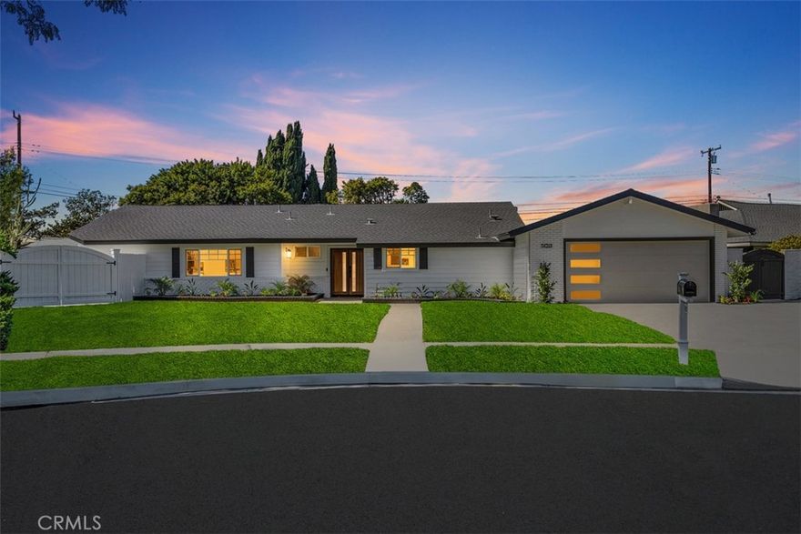 Welcome to 14261 Clarissa Lane, an exceptional single-story ranch-style residence in the coveted North Tustin community—expertly reimagined with timeless sophistication, modern comfort, and true California indoor-outdoor living. Nestled on an expansive ¼-Acre flat lot, this stunning home offers approximately 2,233 sq ft total, including a detached finished studio—perfect as a private home office, gym, creative retreat, or guest suite. Every inch of this property showcases high-end craftsmanship and thoughtful design. The main home features 4 bedrooms and 2.5 beautifully appointed baths, anchored by an open-concept layout that seamlessly connects the living, dining, and kitchen areas. The chef’s kitchen is a true showpiece, featuring new soft-close cabinetry, designer lighting, new stainless-steel appliances, and an oversized peninsula with quartz waterfall edge. In the family room, white oak built-ins with a mounted 65-inch TV, a built in bar with white oak floating shelves, shiplap accent wall, and custom wraparound fireplace mantel, create an elevated yet comfortable setting. The primary suite offers a serene retreat with dual closets and a spa-inspired bath featuring a walk-in shower with bench, double-sink oak vanity, pendant lights, and elegant finishes.  Throughout the home you will find wide-plank flooring, new baseboards, recessed lighting, new doors, and other upgrades. Step outside to an expansive backyard designed for both relaxation and entertaining, with a large patio and lush grassy area—perfect for gatherings, play, or a future pool addition. The detached studio is fully finished and climate-controlled, offering incredible versatility for today’s lifestyle needs. Additional highlights include RV parking with sewer hook-up, new epoxy garage floor, newer AC system with smart thermostat, full PEX re-pipe, tankless water heater, new modern garage door, smart video doorbell, and EV Charger. Set on a quiet double cul-de-sac street and zoned for the highly sought-after Foothill High School. Low property taxes, no HOA, and no Mello-Roos.  A rare opportunity to own a completely remodeled, move-in-ready home of this caliber.  Buyer to verify all square footage, measurements, and information to their own satisfaction.