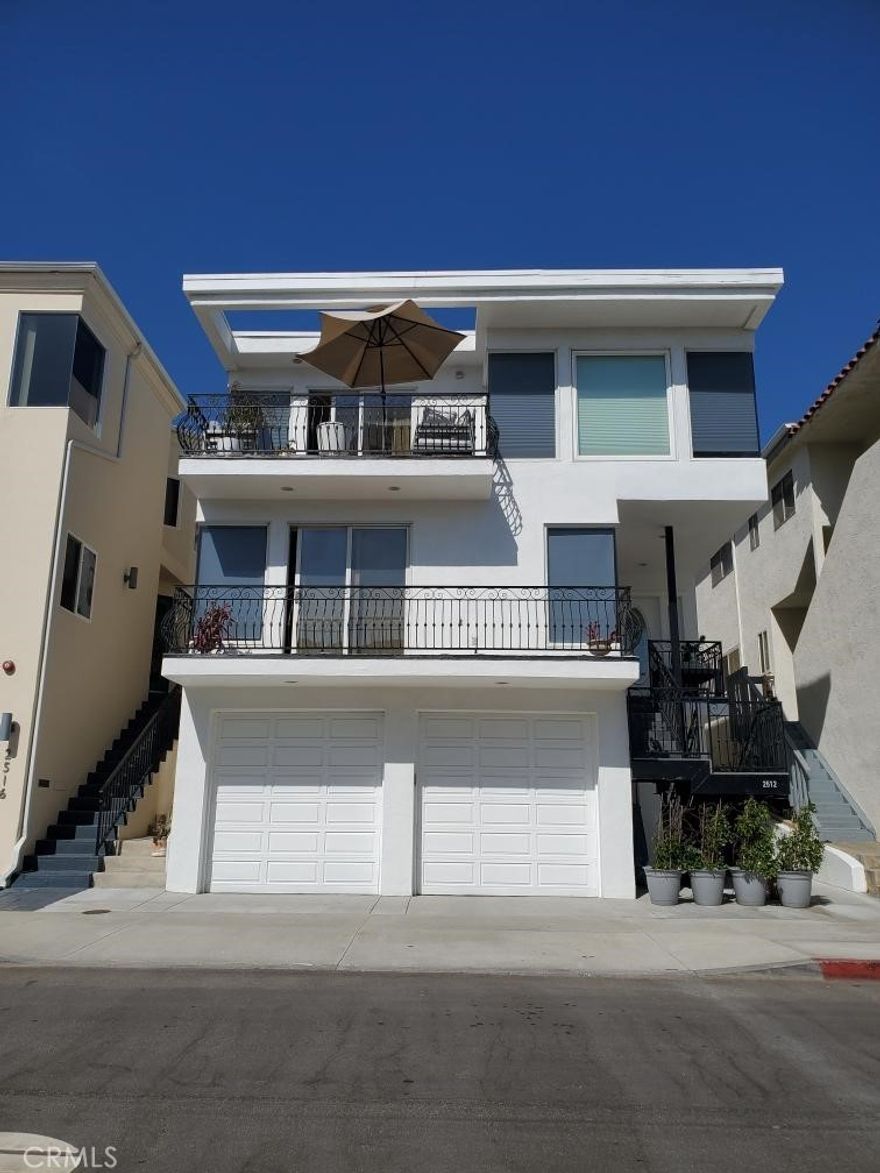 One block to the beach, three houses from Bruce’s, and fully equipped for everything from surfboards to wine bottles—this Manhattan Beach townhome is basically coastal living with a grin.  This detached, freestanding rental ditches the power lines (utilities are underground) and brings the sunshine. A two-car garage with surf racks plus a converted third space/home office keeps both boards and Zoom calls happy. An outdoor surf shower waits for sandy feet, and three of the four bathrooms have been recently remodeled for when the ocean isn’t the only place you want to rinse off.  The kitchen is a gourmet playground: six-burner Viking stove with griddle, Viking dishwasher, built-in refrigerator, wine cooler, and an island that seats six—perfect for family, friends, or whoever shows up after volleyball at Marine Avenue. The gas fireplace in the living room adds cozy contrast to all that sea breeze, and multiple living areas (TV room, dining room, den, office, beach room) mean everyone gets their space without stepping on each other’s sandy toes.  Location nails it—surf and volleyball right out front, Junior Guards two blocks away, downtown and North Manhattan restaurants on either side, and Grand View Elementary within walking distance.  From sunrise surf to sunset wine pours, this home nails the Manhattan Beach trifecta: style, comfort, and location. Rare rentals like this don’t just come along—they get scooped up faster than a parking spot on a Saturday morning.