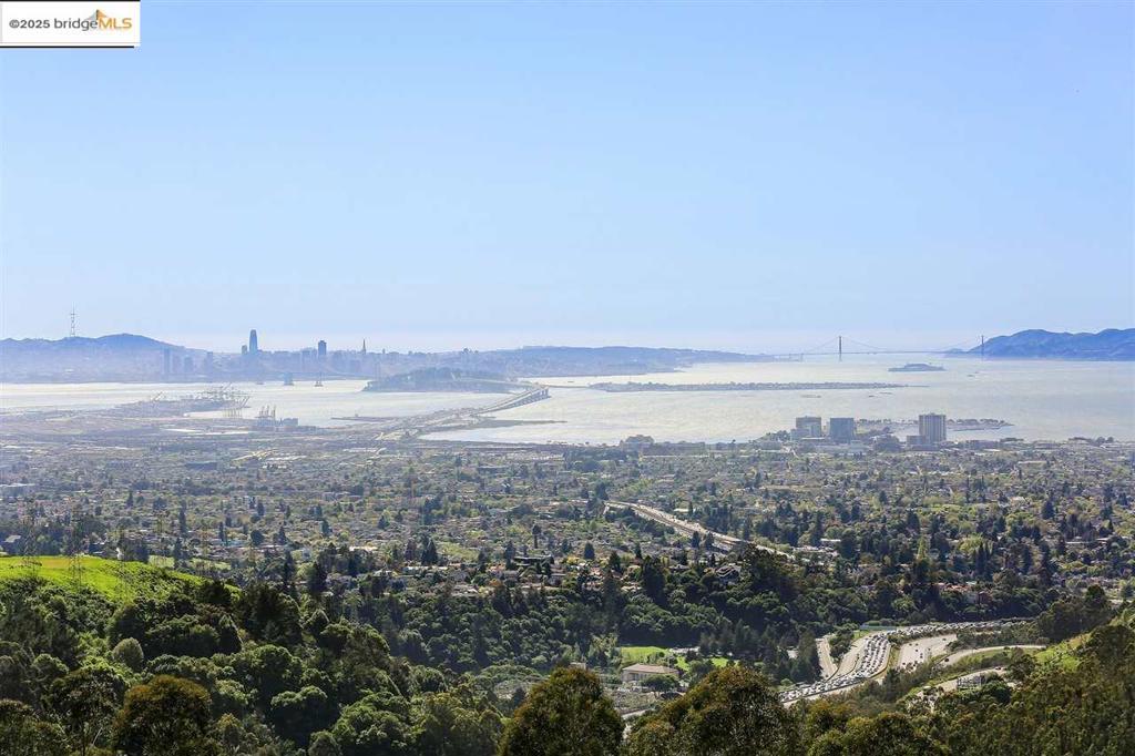 Level land with Panoramic views of San Francisco and its 5 bridges. This is a unique lot with considerable upside. Wide frontage opens the door to a myriad of design approaches. One of 2 vacant lots listed with the adjacent house under MLS #41096624. The cumulative price of all 3 properties is $1,999,000. Sellers prefer to sell all three properties together. Views: Downtown, Ridge