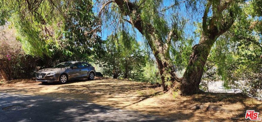 Rare LARD1.5 lot spanning from street to alley. A great buildable site with easy access from lower alley and Fredonia Dr. Build up to 3 units or homes/Units with views of Universal City and beyond. Great buildable lot with easy access from the Street to Alley.  Create income with great views, walkability to restaurants & public transportation, and the best of city living at your doorstep. Survey available. Transit Priority Area in the City of Los Angeles. An extremely desirable location that combines privacy and convenience, with easy access to major studios, including Universal Studios and Warner Bros., as well as the vibrant shopping and dining districts of Hollywood. Enjoy proximity to the iconic Hollywood Bowl, and quick access to the 101 freeway, making downtown Los Angeles, Beverly Hills, and the Valley just a short drive away. This is a rare opportunity to own and develop in one of LA's most prestigious neighborhoods.