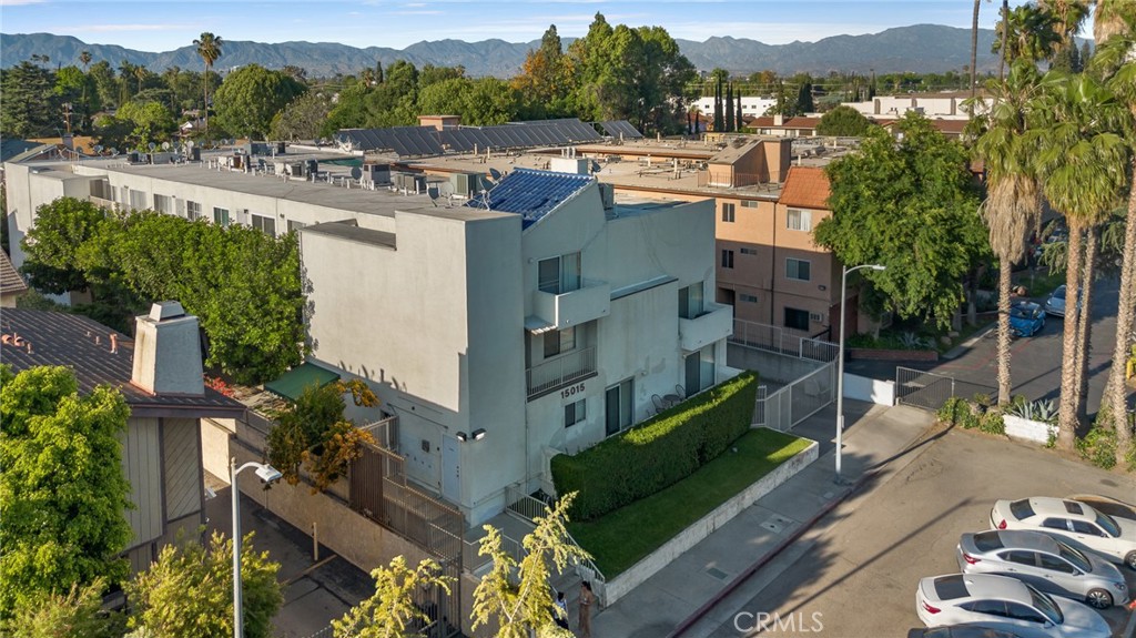 Property may be eligible for FHA SPOT APPROVAL, meaning 3.50% down payment and credit scores as low as 620! Welcome to 15015 Sherman Way #314, a beautifully upgraded top-level condo nestled in the heart of Van Nuys. This spacious 2-bedroom, 2-bathroom unit offers 1,004 square feet of comfortable and stylish living space, thoughtfully designed for both relaxation and convenience. Step inside to a bright and airy living room featuring sleek laminate flooring, a cozy fireplace, custom built-in cabinetry, and a mounted TV that’s included with the home. The open layout seamlessly flows into the dining area and kitchen, where you'll find durable laminate flooring, rich wood cabinetry, abundant counter space, and plenty of storage—ideal for anyone who loves to cook or entertain. Down the hallway, you’ll discover two generously sized bedrooms and two full bathrooms, perfectly situated for privacy. The primary suite is a true retreat with its large walk-in closet, private balcony—perfect for your morning coffee or evening unwind—and a well-appointed en-suite bathroom. Additional highlights include an in-unit stackable washer and dryer, all major appliances (refrigerator, stove, dishwasher) included, and central heating and air. This unit also comes with two assigned tandem parking spaces in a secure gated garage, adding peace of mind and convenience. The well-maintained complex is located close to shopping, dining, public transportation, and everything Van Nuys has to offer. Whether you're a first-time buyer, downsizing, or investing, this move-in ready condo is a fantastic opportunity to enjoy comfortable, low-maintenance living in a prime location.