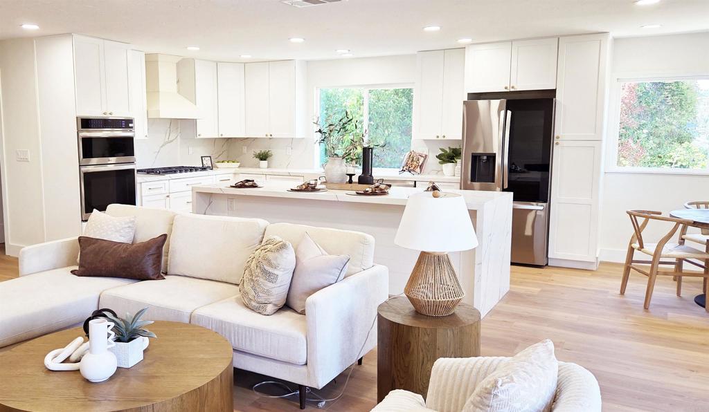 This beautifully updated 4 bedroom, with 3 bathrooms (two 3/4, one 1/2) single-story home is nestled on a peaceful 0.8-acre lot in Escondido. Every inch of the interior has been thoughtfully renovated with designer finishes, including luxury vinyl plank flooring, quartz countertops, and upgraded bathrooms that bring modern elegance to every space. The open, light-filled floor plan offers a seamless flow between the kitchen, dining area, and great room. The stunning kitchen is the heart of the home connects to the main living areas. A cozy fireplace in the great room opens into a secondary living space ideal for relaxing or hosting guests. Step outside to take in the breathtaking backyard—complete with a covered patio, sparkling pool, spa, and lush landscaping—all set against a backdrop of gorgeous views that invite you to unwind. Additional highlights include an attached two-car garage and ample space for extra parking in the driveway, whether for guests, recreational vehicles, or future possibilities.