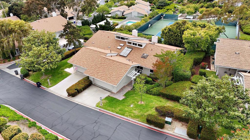 Incredible value! Rare single-story boasts a sizeable open living space. The living room and primary bedroom seamlessly extend to a spacious patio, offering views of lush green scape and the tennis courts beyond. The only monthly utility or service cost that you pay for is gas and electric. The HOA fees cover everything else! 4 swimming pools with hot tubs, 4 tennis courts, gym, sauna, roof repair/replacement, exterior paint, cable, internet, water, fire AND earthquake insurance, termite mgmt, and more!!! There is a fun loft space that can be used as an extra workspace, storage space or even a junior play area. This is a lovely parklike community that offers the perfect balance of tranquility and activity. The amenities here cater to any number of interests. This is a lovely parklike community that offers the perfect balance of tranquility and activity. The amenities here cater to any number of interests. Meander along walking paths, unwind in one of the four beautiful swimming pools with hot tubs after playing tennis or practicing on the putting green. You can also indulge in the resort-like main clubhouse, complete with a large meeting room, kitchen, library, gym with top-notch equipment, and even a sauna. New roofs, exterior paint and driveways were all recently redone in the last 3 to 4 years. HOA fees cover cable, internet, water, fire and earthquake insurance and pest management. Newer a/c, furnace, plumbing. New flooring, interior paint.