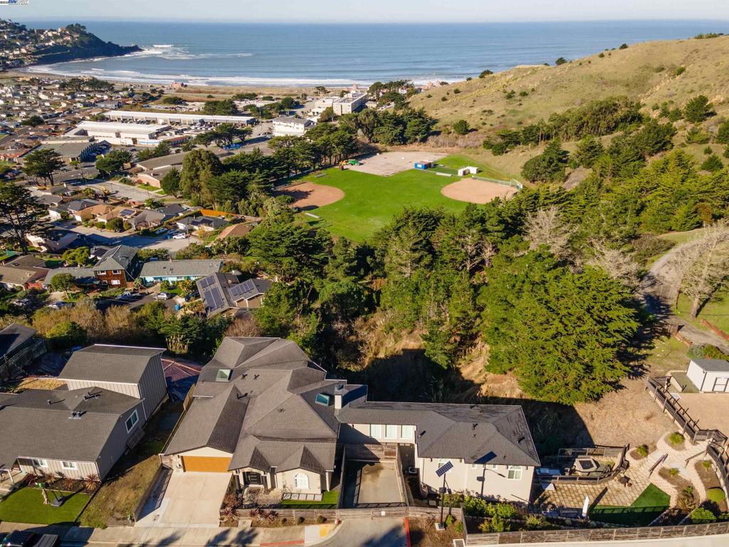 Motivated Seller - HUGE Price Reduction!!! Views! Views! Views! Luxury Oceanfront Living in Pacifica - just a short walk from the beach! Discover this stunning 5,950 sq/ft luxury estate in Pacifica, boasting unobstructed, jaw-dropping views of the Pacific Ocean from almost every room. Situated on nearly half an acre, this home offers 5 spacious bedrooms, 5 bathrooms, and 2 half bathrooms, including 2 primary suites. Completed in 2020, the massive addition enhances this masterpiece of design, featuring a highly upgraded kitchen, terraced backyard, endless decks with ocean views, and a rec room with a bar and full bathroom. Additional amenities include an extra 4-car parking pad with potential to add an ADU (buyer to verify). This elegant retreat combines comfort, luxury, and breathtaking natural beauty, making it the perfect blend of coastal living. Don't miss your chance to own this Pacifica gem—schedule a private tour today! An absolute MUST SEE!