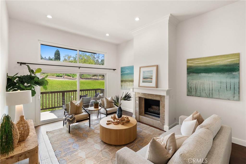 Welcome to an exceptional opportunity to own a highly upgraded 2-bedroom, 2-bathroom residence nestled along the 6th fairway of the exclusive Big Canyon Golf Course. Situated in one of Newport Beach’s most desirable communities, this meticulously maintained split-level condominium offers the perfect blend of tranquility, sophistication, and Southern California lifestyle. Enjoy sweeping, unobstructed golf course views from the expansive, full-width deck that seamlessly connects the main living area and the primary suite—ideal for indoor-outdoor living and entertaining. The tastefully remodeled kitchen features custom cabinetry, a charming farmhouse sink, stainless steel appliances, and opens to a dedicated dining area complete with a wine fridge and wet bar. The spacious living room boasts dramatic two-story ceilings, a cozy fireplace, and direct access to the oversized patio overlooking the lush fairways. The generously sized primary suite is a peaceful retreat with voluminous ceilings, direct patio access, and serene golf course views. The remodeled primary bath showcases dual sinks, a luxurious oversized walk-in shower, and custom built-in cabinetry. Additional highlights include engineered hardwood flooring, dual-pane windows, recessed lighting, air conditioning, and thoughtful designer touches throughout the home. Uniquely located on the private, single-loaded Sea Pine street within the sought-after Big Canyon McLain community, this home includes a detached two-car garage and ample guest parking—offering privacy and convenience rarely found in the community. Whether you’re seeking a primary residence or a second-home investment, this residence delivers effortless luxury with community amenities including a community pool, spa, tennis courts, and professionally maintained grounds. Located in close proximity to world-class shopping and dining at Fashion Island, renowned beaches, cultural venues, UCI, and John Wayne Airport. Don’t miss your chance to enjoy resort-style living in the heart of Newport Beach.