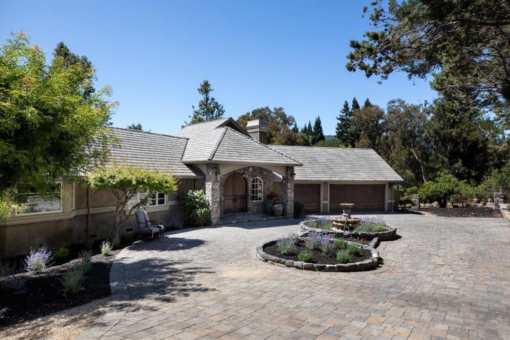 This stunning custom home has 3 bedrooms, an executive office, and 3.5 baths on approximately 1 acre with beautiful western hill views. The interiors are appointed with gorgeous hardwood floors throughout and artistic embellishments that include lighting, fireplace surrounds, a parquet stone and wood patterned floor in the foyer, and custom stair railing. Highlights include a dramatic living room with entertainment bar, formal dining room, and fabulous chef's kitchen with adjoining family room. A junior primary suite complements the luxurious primary suite plus there is a third bedroom, hallway bath, and executive office. Outdoor living is equally impressive with a vast terrace, fire pit, barbecue kitchen, and level lawn all backed by western hill views. Access to excellent Los Altos schools completes the setting.