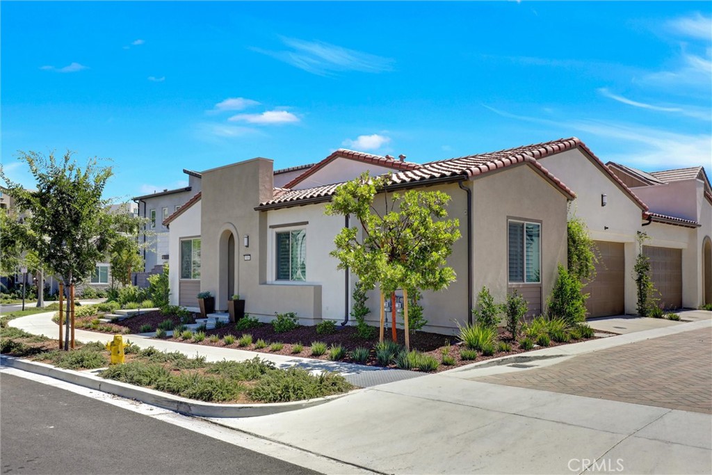 Designer-inspired, impeccably maintained, this stunning residence in the resort-style community of 55+ Gavilan Enclave of Rancho Mission Viejo. This open-concept home blends elegance, and comfort. At the heart of this home lies a stylish kitchen, showcasing sleek quartz countertops and premium Stainless steel appliances, seamlessly opening to the great room, an inviting space for family gatherings. The spacious primary suite offers a spa-like ensuite with dual sinks, a large shower and a custom-designed walk in closet. Guests will enjoy their own comfortable Haven in the second bedroom with a full bath. Additional highlights include a striking stacked wall framed sleek linear fireplace, paid solar, kitchen water filter, plantation shutters throughout, additional cabinetry. Beyond the home, you'll enjoy a vibrant, resort-style lifestyle with exclusive access to private Gavilan 55+ amenities including The Perch, The Hacienda, The outlook, The BBQ Barn, and The Getaway. Stay active and connected with a state -of-art fitness center, social lounges, and when the grandkids visit? You'll have full access to Rancho Mission Viejo award-winning all-ages amenities, arcade, community farms, fitness centers, indoor basketball gym, putting green, Sports park, tennis and pickleball courts, parks, and events that make this community unlike any other.