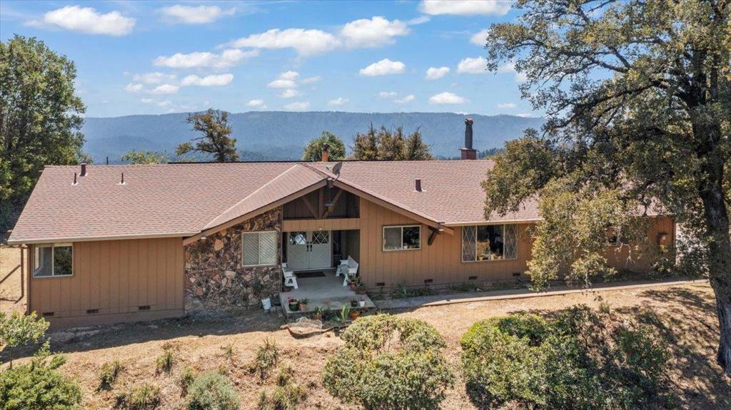 Charming Single-Story Home in the Las Cumbres Community. Set on a prime site, this inviting single-level home is one of the original residences in the highly sought-after community. The property is surrounded by mature fruit trees, usable land, & sweeping views and offers a tranquil setting. The spacious floor plan features a large living room with vaulted ceilings, a cozy fireplace, & picture windows that frame the views. The charming kitchen has abundant workspace. An oversized dining room provides an ideal space for entertaining, while the sunroom/office overlooks the backyard & offers views. The bedroom wing includes a generous primary suite with stunning views & en-suite bathroom featuring dual sinks. 3 additional well-sized bedrooms & a full bathroom complete the bedroom wing. Further highlights include a two-car garage with an attached workshop or office complete with a sink and private entrance, perfect for remote work, hobbies, or creative space. Enjoy easy access to South Bay & Peninsula employment centers and the many amenities Las Cumbres offers: a community garden, clubhouse, bocce, basketball and tennis courts, swimming pool, playground, and over 1,200 acres of shared conservation land to explore. Served by highly-rated Lakeside Elementary & Los Gatos High.
