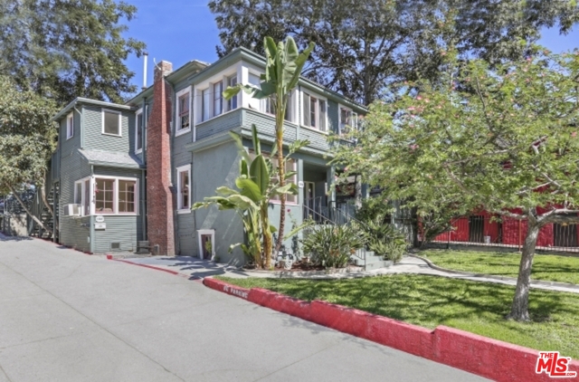 Victorian era duplex in the heart of Echo Park. Very close to Elysian Park, a skip and a jump to Chango's and Cookbook and a short jog to Sunset Bl and the Lake. What could be better ! First floor 1BR/1BA unit (1701-3/4) has generous-sized rooms, high ceilings, large windows, wood floors, living rm with decorative FP, vintage pocket doors that open to the dining rm, very large kitchen and an office with separate entry. The bedroom suite has access to a private deck w/spa that can also open up to the front deck and porch when entertaining. The basement area has been transformed into a cozy library. Upstairs is a 2BR/1.25BA unit (1701-1/2) with an entry foyer/study, large eat-in kitchen, laundry, living room, delightful sleeping porch, finished loft/attic space and its own private yard.