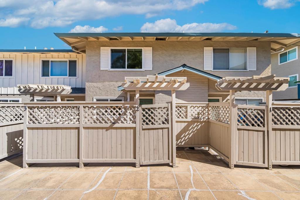 Welcome to this townhouse-style condo in the convenient Cupertino Creekside community. Enter through a private front yard into the beautifully updated gourmet kitchen with quartz countertops, modern appliances, and ample white cabinetry. The kitchen flows into the dining area, leading to an inviting living room with sliding doors to a private balcony overlooking the community garden. A stylish updated half bath with quartz countertop adds convenience. Upstairs, find two spacious bedrooms and an updated hallway bathroom with quartz countertops, a large mirror, and shower over tub. In-unit washer and dryer provide added ease. Community amenities include a fitness center, pool, and clubhouse. Ideally located in West San Jose, within walking distance to Calabazas Park and library, and close to shopping, restaurants, and groceries. Easy access to Highway 85 and a short commute to tech companies. Top-rated public schools, including Lynbrook High. Don't miss this great opportunity!