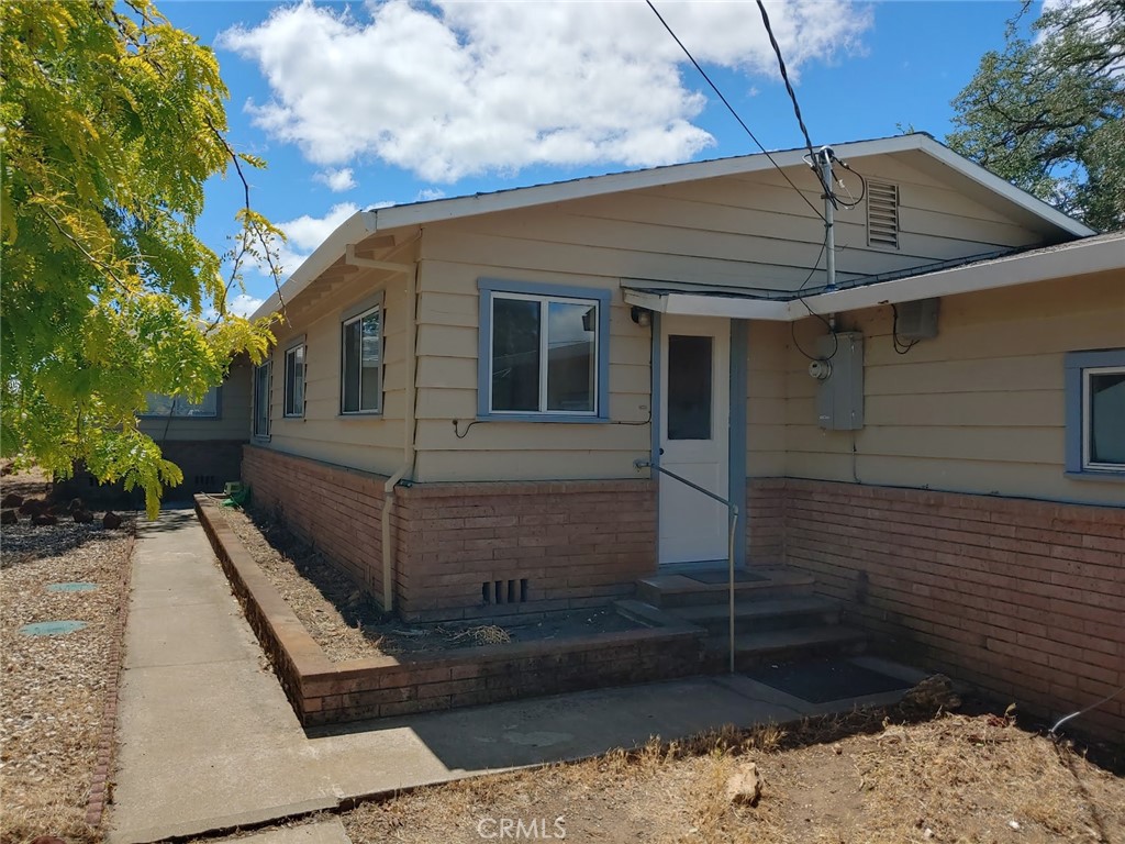 Over 2600 Square Foot 4 Bedroom, 3 Bathroom Home with Large 2 Car Attached Garage and a Converted Garage/Workshop, now a possible 1 Bedroom, 1 Bathroom Additional Dwelling Unit, Overlooking Clearlake and It's Scenic Surrooundings! There are 1.45 Acres, plenty of Room to expand and lots of Room for Gardening, Orchard, Pool, and RV Parking. The home is in good condition, but needs some updating. Move in and make this your Dream Come
True! There is a large storage building and a covered parking area. Come spend a moment to take in the breath taking view. Very Private, yet just minutes from shopping, parks, medical facilities, and Access to Clearlake.