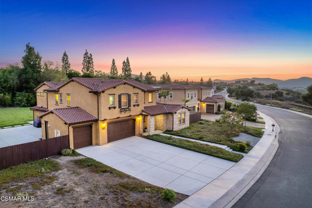 Welcome to your dream home, a stunning blend of luxury, comfort, and functionality, located in a premier gated community with breathtaking canyon and hillside views. Built in 2017 and situated on one of the largest lots in the neighborhood, this 5-bedroom, 4.5-bath masterpiece offers 4,470 sq ft of thoughtfully designed living space with no neighbors behind or across the street, ensuring rare privacy and serenity.Step inside to soaring 9+ foot ceilings, rich hardwood floors with elegant herringbone entry detail, and an open floor plan that seamlessly connects the expansive living room, formal living area, and gourmet kitchen. The chef's kitchen is a showstopper, featuring top-of-the-line Thermador appliances, including a bread warmer, a massive island, abundant cabinet storage, and oversized sliding doors that invite the outdoors in. Entertain effortlessly with the indoor-outdoor flow to a large covered patio complete with a fireplace and TV.Upstairs, greeted with a secondary living room dividing the primary suite and additional bedrooms. The sprawling primary suite is your private retreat, boasting dual walk-in closets, double vanities, and a covered balcony with a fireplace and TV. Two dedicated laundry rooms, one on each floor, add unmatched convenience, while the first-floor guest suite and mudroom offer smart, flexible living.The entertainer's backyard is designed for unforgettable gatherings, with generous side yards, a turf play area, and ample space to relax or play. Additional highlights include fully owner solar, a 3-car garage, long driveway for extra parking, dual-zone A/C, tankless water heater, and access to inviting community pools and nearby parks.Perfectly located near the 101 and 23 freeways for easy commuting, this home offers both luxury and lifestyle. Don't miss your chance to own this rare gem!