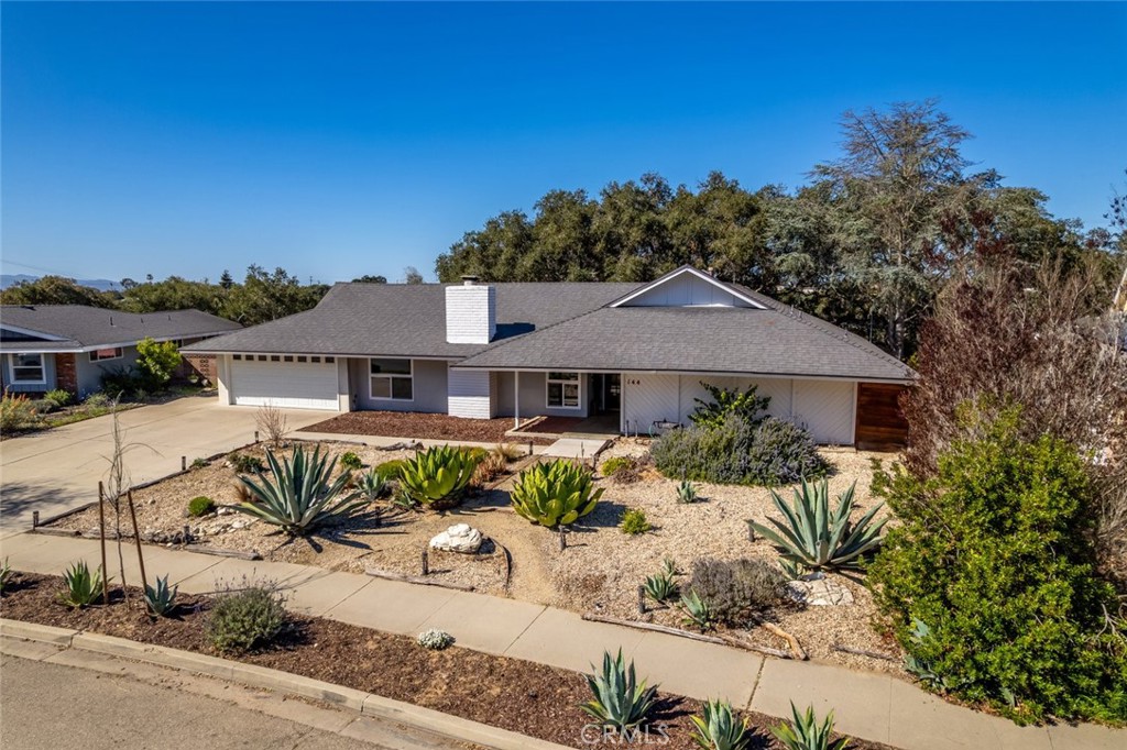 Welcome to 144 Oakmont Ave, a stunning updated 6-bedroom, 3-bathroom home in the desirable Mission Club community. This stunning property offers not only one of the most beautiful lots in the Vandenberg Village area, but also an ideal blend of modern upgrades, generous living spaces, and resort-style amenities, all with no HOA! The bright and inviting living area features a cozy fireplace with a striking blue accent. The open layout seamlessly connects to the dining space, showcasing a stylish accent wall for a contemporary touch. Wood-look laminate flooring laid in an elegant herringbone pattern adds warmth and character throughout. The well-appointed kitchen offers ample counter space and storage as well. The bathrooms are tastefully updated, with sleek countertops, modern fixtures, an overall clean aesthetic. Outside, the low-maintenance, drought-tolerant landscaping enhances the home's curb appeal while providing a serene entrance. The spacious driveway and attached garage offer plenty of parking. ALSO, located just a couple minutes away from the Mission Club Golf Course, this home provides access to incredible amenities, including a neighborhood clubhouse, renovated pool, a full gym, updated basketball and pickleball courts, and an on-site golf course restaurant. Plus, an optional Membership offers even more perks for golf enthusiasts. Don't miss this rare opportunity to own a move-in-ready home in a prime location.