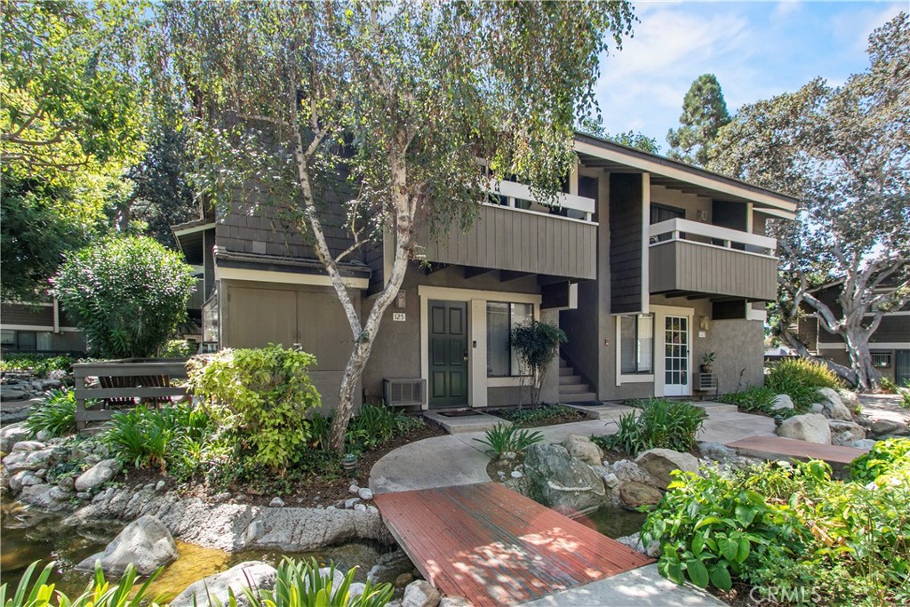 BEST VALUE IN IRVINE! Don't miss out on this UPDATED and immaculate end unit condo in the heart of the Springs community. The relaxing sound of babbling brooks will greet you in the morning, join you as you relax on your private balcony and lull you to sleep every night. A contemporary vibe greets you the moment you enter this OPEN FLOOR PLAN including modern, designer carpet, neutral color palette, quartz counter surfaces and new fixtures. Dual pane vinyl windows and slider keep this home cozy in any climate. This layout can not be beat with large living room with slider to PRIVATE BALCONY, adjoining dining area and perfect kitchen with plenty of storage and counter space. The bedroom suite has room for king size bed, plus separate dressing area has DUAL WARDROBE CLOSETS...plenty of storage here! Dare to compare our $365 monthly HOA dues with any other Irvine community, plus NO MELLO ROOS! This is the perfect spot for your first home, second home, downsizing or investing. Community amenities include multiple pools and tennis courts. Fantastic area with nearby shopping and parks and adjacent to the Eastwood Trail. Welcome home!