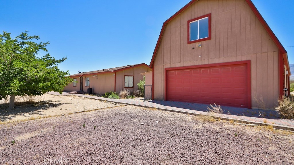 THIS IS THE ONE!!!!!! Welcome to your dream oasis nestled in Lucerne Valley. This captivating property, set on an expansive 20-acre lot, offers a serene desert view that will take your breath away, providing a perfect blend of tranquility and adventure. As you step inside this charming home, you’ll be greeted by a warm inviting interior, boasting 3 bedrooms and 2 bathrooms, perfectly designed to accommodate comfort and privacy. The heart of the home features quartz countertops that add a touch of elegance to the spacious kitchen, making it an ideal space for both cooking enthusiasts and those who love entertaining.
The property’s unique attributes include a two-story garage that provides ample space for vehicles, hobbies, ar additional storage, ensuring that your lifestyle needs are met with ease. For those who value sustainability and autonomy, the inclusion of its very will is a noteworthy feature, offering a self-reliant living experience.