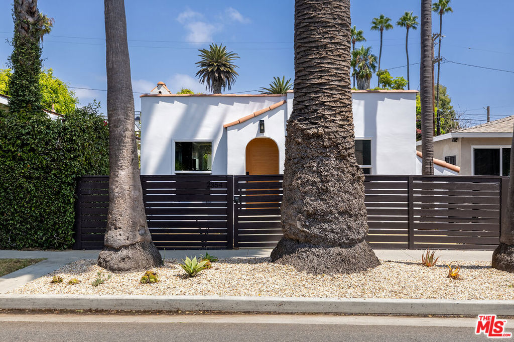 Just completed a full, permitted renovation! This charming Spanish bungalow blends timeless character with modern comfort, including energy-efficient mini-split heating/cooling. The 2-bed, 1-bath home offers an open living area, a fully renovated kitchen with stone counters and all new stainless appliances, and a stylishly remodeled bath. Major improvements include upgraded electrical with new panel, new plumbing, tankless water heater, new flooring, and fresh landscaping. The detached two-car garage has been transformed with new flooring, modern garage doors, and opener system ideal for parking, storage, or flex space. Enjoy a private backyard perfect for entertaining, ideally located north of Washington and west of Abbot Kinney, just minutes to Venice Beach, shops, and dining. Public record shows 752 sq. ft.; per architectural floor plan approx. 785 sq. ft. Buyer to verify