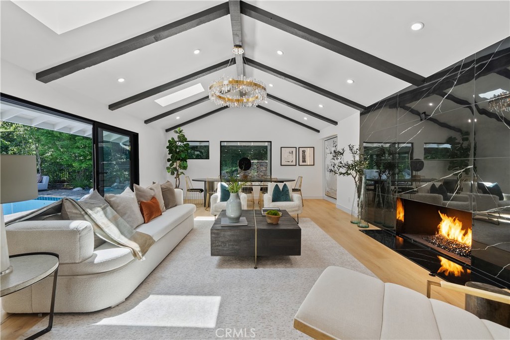 Enchanting La Cañada Flintridge Retreat!
Privately nestled among mature trees, this beautifully upgraded 4BD/4BA estate blends timeless charm with modern luxury. The living room features soaring ceilings and an Italian porcelain fireplaces with views of the sparkling pool. Gourmet kitchen includes luxury paneled appliances that opens to a light-filled dining area overlooking the lush front garden.
Two spacious primary suites each offer walk-in closets and spa-inspired baths, all designed with a cohesive, elegant style throughout the home. The secluded backyard is a true oasis with pool, spa, pond, and a natural creek with plenty of new easy maintenance turf for the kids to enjoy.
Additional features include a solar-powered electrical system, Private gated entrance, 2-car garage, and a detached studio/office ideal for remote work or creative use.
This rare offering combines privacy, style, and comfort—an exceptional opportunity in the heart of La Cañada Flintridge!