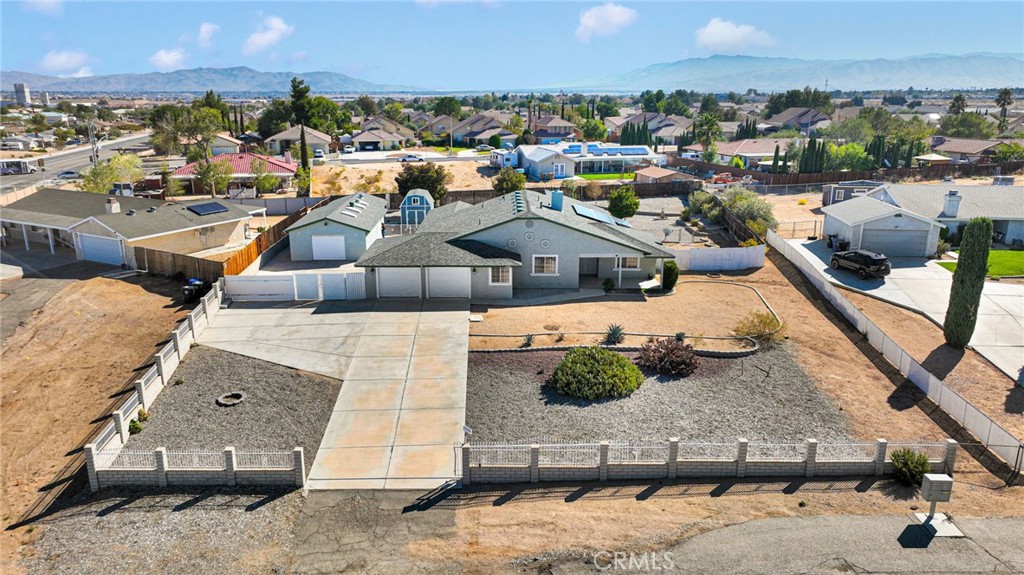 Welcome to 12871 4th Ave in Victorville! This spacious home sits on a 0.63-acre lot and features three large bedrooms, two bathrooms, and a bright, open layout filled with natural light. Recent upgrades include a new 10x12 shed, a 20x40 workshop with 220V, a whole house water filtration system, barn-style doors in the master bedroom, a solar gate opener, and much more. The property offers a large attached 2-car garage, RV parking, and paid-off solar panels for energy savings. Conveniently located near shopping, schools, and freeway access, this home combines comfort, functionality, and abundant space all in one!