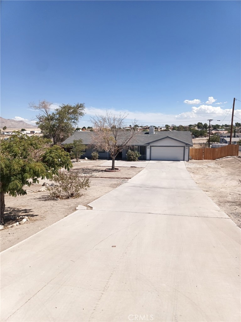 Welcome to this Charming Desert Home. The home features new flooring throughout the home. Freshly painted interiors create a bright and inviting atmosphere. Three generously sized bedrooms, each equipped with a ceiling fan. Spacious master bedroom featuring an attached master bath. Living room with a cozy fireplace. Kitchen includes a sliding glass door that opens directly to the covered patio.
Large, covered patio, ideal for gatherings and relaxation. Expansive backyard, enclosed by two separate fences. The first fenced area offers a cozy, private outdoor space. The second, large area is suitable for a garden, pool or quite retreat
If your seeking a home with ample space to bring your vision to live, this property provides the perfect opportunity.