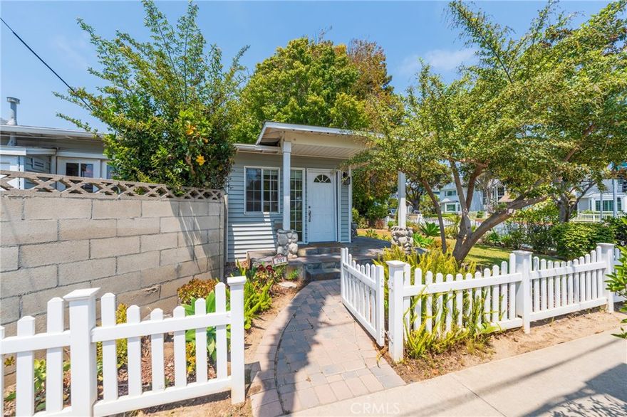 TWO HOMES ON ONE LOT! Zoned R-2 - Incredible Opportunity in Huntington Beach! Nestled behind classic white picket fences on a spacious corner lot, this charming single level 4 bed, 2 bath Main Home (1,505 sqft, built in 1954) and detached two-level 3 bed, 2 bath Guest House (1359 sqft, built in 1990) offer versatile living in a prime location. Step inside the beautifully landscaped Main Residence and be welcomed by gleaming hardwood floors, a large bay window in the light-filled living room, and elegant French doors in the dining area that open to a private courtyard - perfect for entertaining or enjoying the sunshine and ocean breezes. The kitchen is a cook's delight with newer appliances, ample countertop space, generous cabinetry with extra-large pantry, and easy access to the convenient indoor laundry room. The spacious step-down primary suite features a faux fireplace, a generous walk-in closet, and sliding doors that open to the sunny patio.Two of the three additional bedrooms include ceiling fans for year round comfort, and the home is enhanced with smooth ceilings and crown molding throughout. A 2-car garage plus a carport provides plenty of parking. The detached Guest House offers flexible living for multi-generational families, guests, or rental income. On the lower level, you'll find a bedroom and full bath, while upstairs features two additional bedrooms, a bright, open-concept living room and a kitchen with dining area that opens to a breezy balcony - ideal for morning coffee or sunset views. The upstairs primary suite features soaring ceilings and an en-suite bath with granite countertops. All of this is located in a highly desirable Huntington Beach neighborhood - close to shopping, parks, top rated schools, and just minutes from the beach. Additional features include new roof, new plumbing, retrofitting, new insulation, new rain gutters, new heater (conveniently re-located into the attic), newer appliances, and so much more! Don't miss this rare and versatile property - two homes, one lot, endless possibilities!!