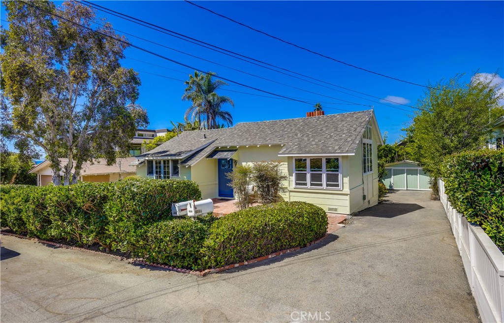 Charming Woods Cove Duplex just steps from the beach! 464 Agate St shows two updated coastal cottages on a larger-than-average lot in one of Laguna Beach’s most desirable neighborhoods. Unit A (front cottage) features 1 bedroom, 1 bathroom, approx. 800 sq. ft. Unit B (rear cottage) includes 2 bedrooms, 2 bathrooms, approx. 850 sq. ft., with custom cabinetry. Both homes have been meticulously maintained with updated kitchens and bathrooms, newer windows, high ceilings in the living rooms, and abundant natural light. Recent improvements include new roofs on both homes last year and a newer fireplace facad. Additional highlights include in-unit laundry for each cottage, ample parking, and well-maintained interiors. Enjoy the convenience of being within walking distance to multiple beaches and just moments from local shops, dining, and galleries along Coast Highway. This versatile property is ideal as a full-time residence, investment opportunity, or a combination of both.