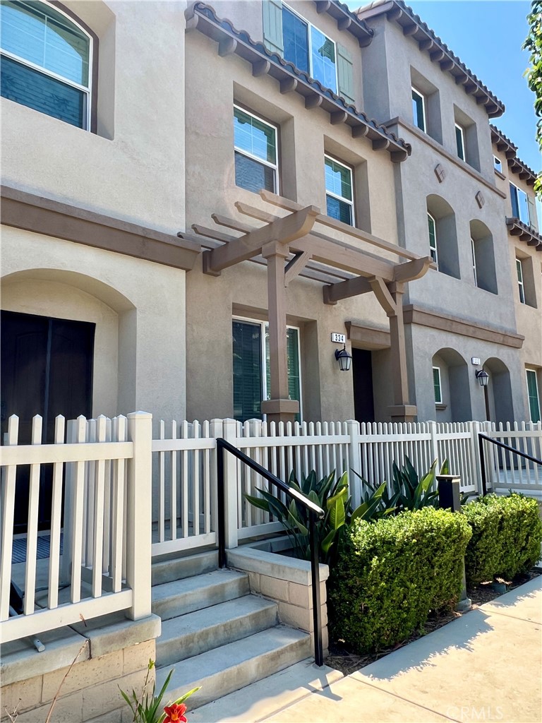 Beautiful Townhome located in the highly sought-after Citrus Junction community of Azusa. This spacious 4-bedroom, 4-bath residence offers over 1,850 square feet of open-concept living, featuring soaring 9-foot ceilings and stylish upgrades throughout. The first floor includes a private bedroom and bathroom. On the second level, the open living area flows into a modern kitchen with quartz countertops, stainless steel appliances, and upgraded cabinetry. Upstairs, you'll find three additional bedrooms, including a generous primary suite. Energy-efficient highlights include a tankless water heater, high-SEER HVAC system, and insulated garage door. Additional features include an enclosed front patio, in-unit washer and dryer, and a direct-access 2-car garage. Prime location just one block from Azusa Pacific University and close to Citrus College, Citrus Crossing Mall, shopping, dining, and freeway access to the 210 and 57. Don’t miss this exceptional opportunity!