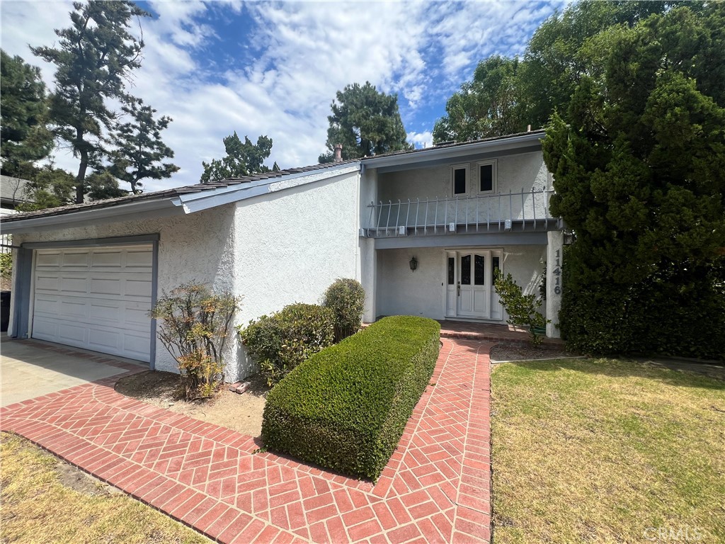 Located in Porter Ranch and Granada Hills Charter High School district. 4 bedrooms plus 2.50 baths need some TLC. Stepdown living room with fireplace and french door to rear yard. Formal dining room. Kitchen offers an island & a good amount of cabinets and counter space. All bedrooms upstairs. Primary bedroom with 2 closets and dual sinks in the bathroom. Large skylight in the hallway. Some mirrored wardrobes in bedrooms. Rear yard offers privacy, built in BBQ and alot pf brickwork. Large side yard. 2 car attached garage with direct access. Bring your paint brushes and imagination. This is your diamond in the rough! Partial views.