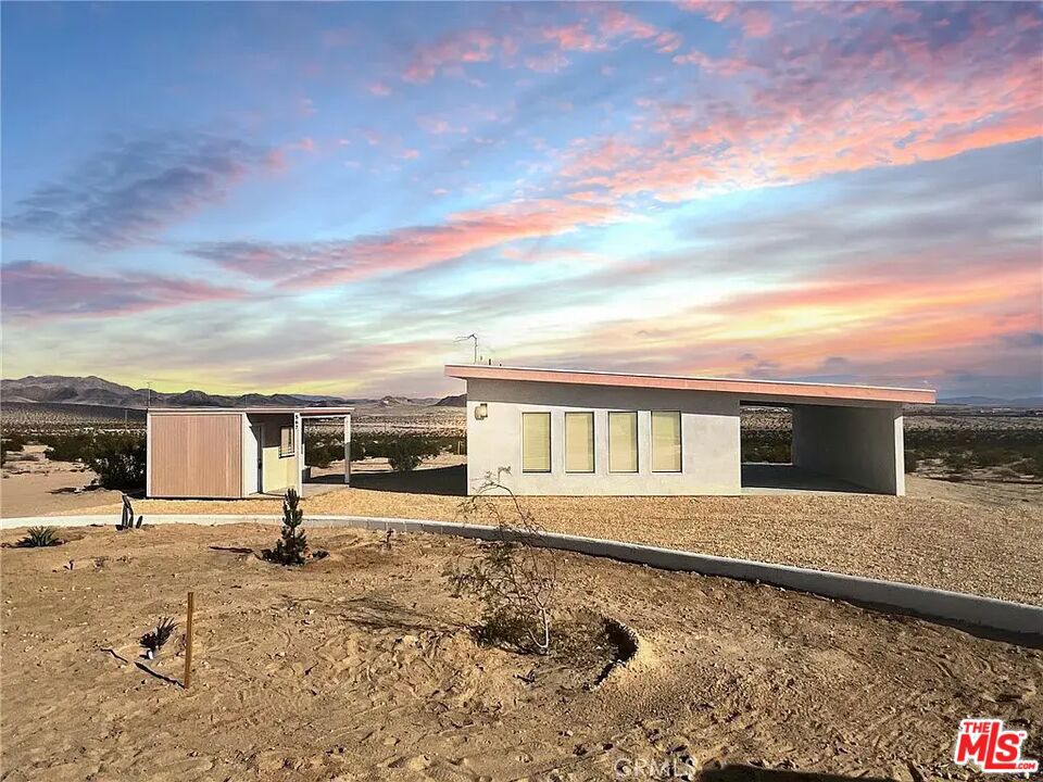 Discover 567 Peffer Avenue, a newly built modern retreat nestled in the desirable Desert Heights area of 29 Palms. Set on a sprawling 5-acre lot, this 750 sq ft home offers the perfect blend of sleek design, comfort, and wide-open space.Inside, you'll find soaring ceilings, recessed LED lighting, and stylish wood-look laminate flooring. The bright, open floor plan centers around a modern white kitchen with soft-close cabinetry, gray quartz countertops, and stainless steel appliances. The spa-inspired bathroom features elegant gold accents, a whirlpool tub, and a stunning tiled shower with jeweled detailing.The spacious primary bedroom opens directly to a private patio and features recessed lighting, a mirrored wardrobe, and sweeping desert views. Dual split HVAC systems provide year-round comfort in both the living area and bedroom. A beautifully built 12x10 shed sits on the original cabin foundation and adds both charm and utility. Future plans for an outdoor bath area offer even more potential for relaxation under the stars. Additional amenities include ceiling fans, solar panels for energy efficiency, a public water hookup, and a 1,200-gallon septic system that's ready to support expansion or an ADU. More than just a home, this is your gateway to elevated desert living.