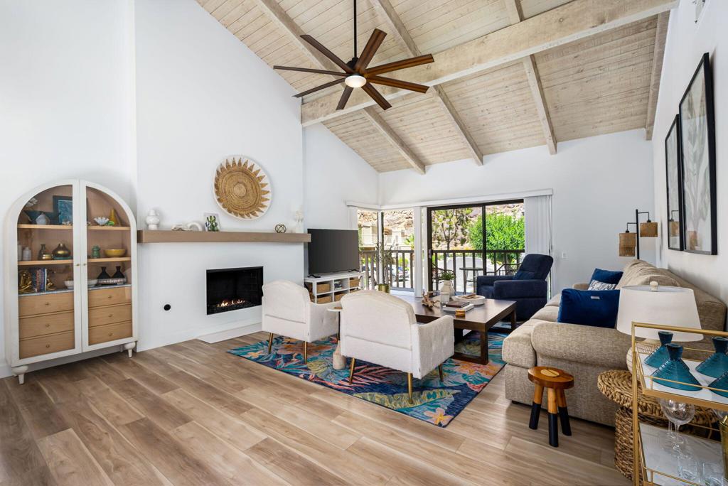 This is perhaps the nicest condo in the entire community - bring ALL offers! *** Long term lease in place starting Nov. 1st, 2025...so new owner can enjoy rental revenue right away! *** Freshly renovated with high-end designer touches throughout such as Versace wallpaper, custom tile-work, and furnishings from Anthropologie and Crate & Barrel. Beautiful, gated Mountain Cove is one of the secret hidden jewels of Indian Wells. Directly adjacent to the legendary Indian Wells CC, and nestled right next to the dramatic Santa Rosa mountains, it offers an absolutely perfect location to its residents. Spacious and well laid-out, this second floor unit features a gorgeous vaulted wood-plank beamed ceiling, gleaming stainless kitchen, and TWO large bedrooms - each with their own private remodeled baths. Then, the entire condo is surrounded by cozy outside patio decks. Large great room with soaring ceiling and gas fireplace is totally open to the dining area and kitchen. Efficient kitchen offers newer appliances, custom cabinetry, and a beautiful quartz waterfall countertop. Convenient inside laundry room with full-sized washer and dryer is conveniently located right off the kitchen. Both bedrooms are well separated ensuring maximum privacy and comfort. Entire condo was completely remodeled recently and is being offered TURN-KEY FURNISHED, allowing its new owners to move right in - OR for immediate use as a luxury rental. Nice corner, end-unit with its own 1-car garage, plus parking space. Indian Wells offers its residents unparalleled amenities such as steeply discounted golfing at two championship courses, discounts at all IW resorts and spas, free use of the Grand Hyatt fitness center, and much more. Condo is within easy walking distance to the world-famous Indian Wells Tennis Garden, home of the ''5th Slam'' BNP Paribas tennis tournament. Von's, Trader Joe's, Stater Bros grocers are a 5-minute drive away as are many restaurants, services, medical. Only 10 minutes to famed El Paseo shopping district with its upscale restaurants, galleries, shopping and amenities, College of the Desert, and McCallum Theater. Golf cart ride to several top golfing venues.