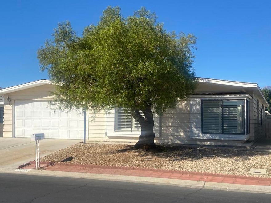 This is one of the few homes on the market in Palm Desert Greens Country Club having a two car garage with an automatic door opener for your convenience and it's under $350,000. The kitchen exhibits pride of ownership and adequate storage and has some updates but still leaves room for updating in the future if desired. You will appreciate the extra large main bedroom with plenty of space for all your bedroom furniture and its own walk-in closet and main full Bathroom. The guest bedroom is just perfect for your overnight company with the 2nd bathroom adjacent. Sliding doors off the family room and main bedroom lead out to the large partially covered patio for your relaxing and entertainment pleasures. So many other features come take a look this could be what you've been looking for.