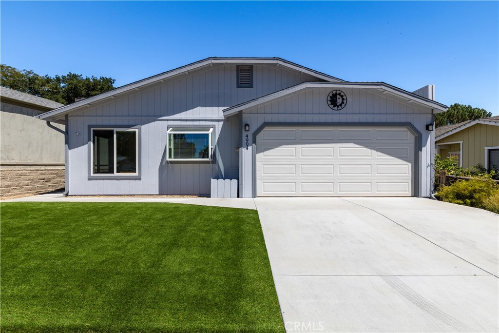 Welcome to this beautifully updated 3-bedroom, 2-bath lake house located in the gated community of Heritage Ranch. This light and airy home features an open-concept layout designed for low-maintenance living with artificial grass and concrete landscaping—no watering needed. The spacious backyard is ideal for entertaining, offering mountain and wildlife views, and both the primary and second bedrooms open directly to the backyard through sliding glass doors. The exterior was freshly painted, and the home includes a cozy wood-burning fireplace, dual-pane windows, Hunter Douglas window coverings, and a safe installed in the floor of the primary bedroom closet. The kitchen has been remodeled with double ovens, the master and guest bathrooms have also been updated, and hallway cabinetry was added in recent years. The home also includes a refrigerator, wine fridge, washer and dryer, and a newer water heater. The garage and driveway offer plenty of parking, and a backyard gate opens directly to a greenbelt. Enjoy all the amenities Heritage Ranch has to offer, including private lake access with a launch ramp, swimming pools, sports and pickleball courts, an equestrian center, scenic trails, a dog park, senior center, and more. Located near schools, shopping, dining, and just minutes from premier wineries. With low HOA fees and incredible community features, you can live the lake lifestyle with modern convenience.